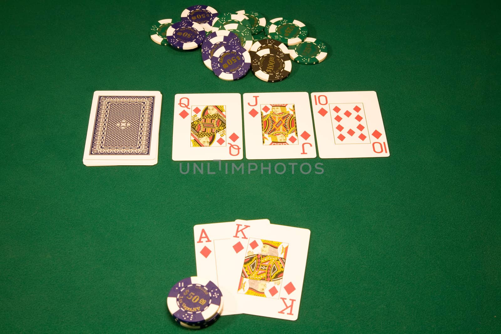 Royal flash in the poker on the green tabl