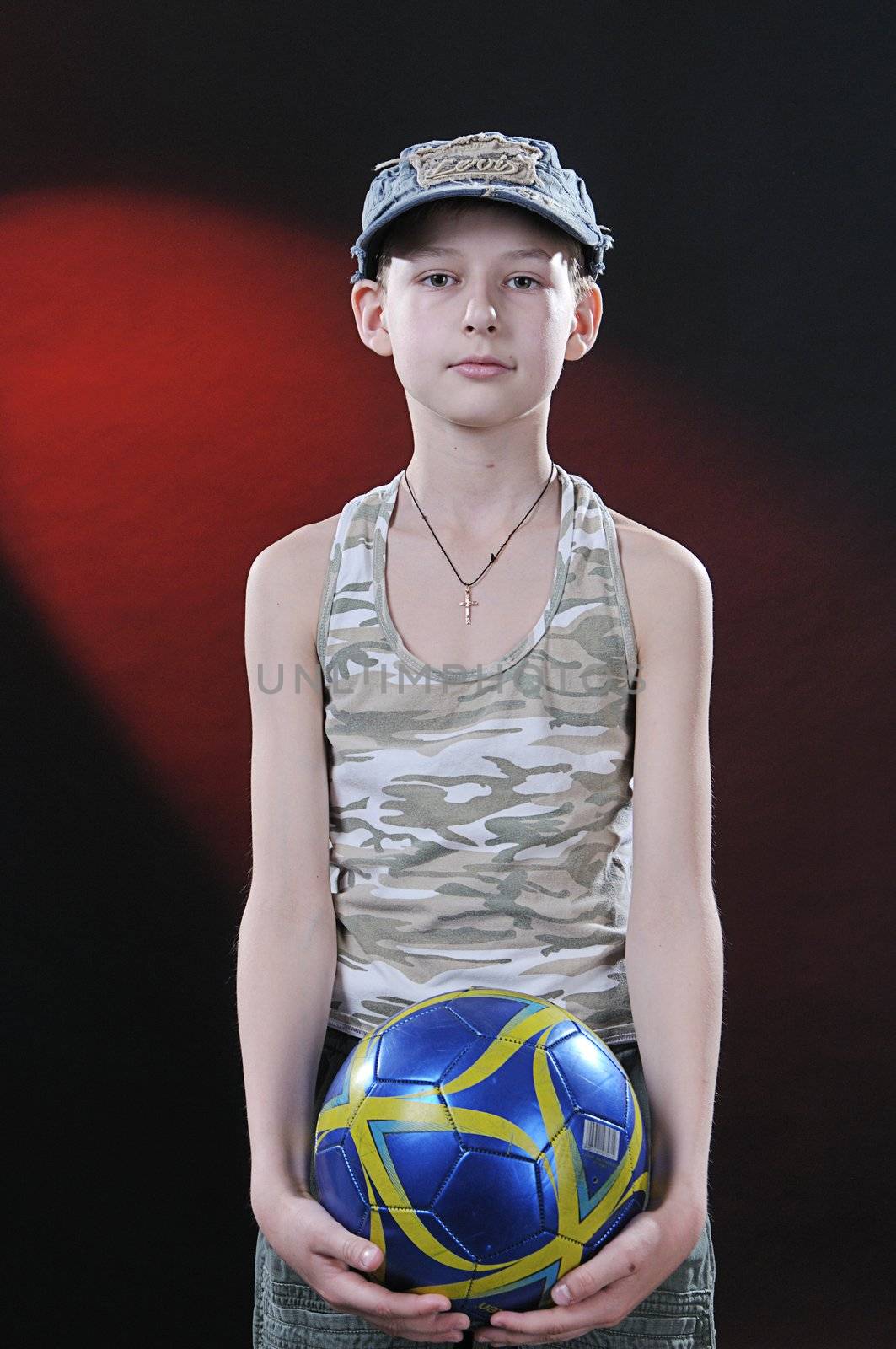 boy of ten years with a ball in hands