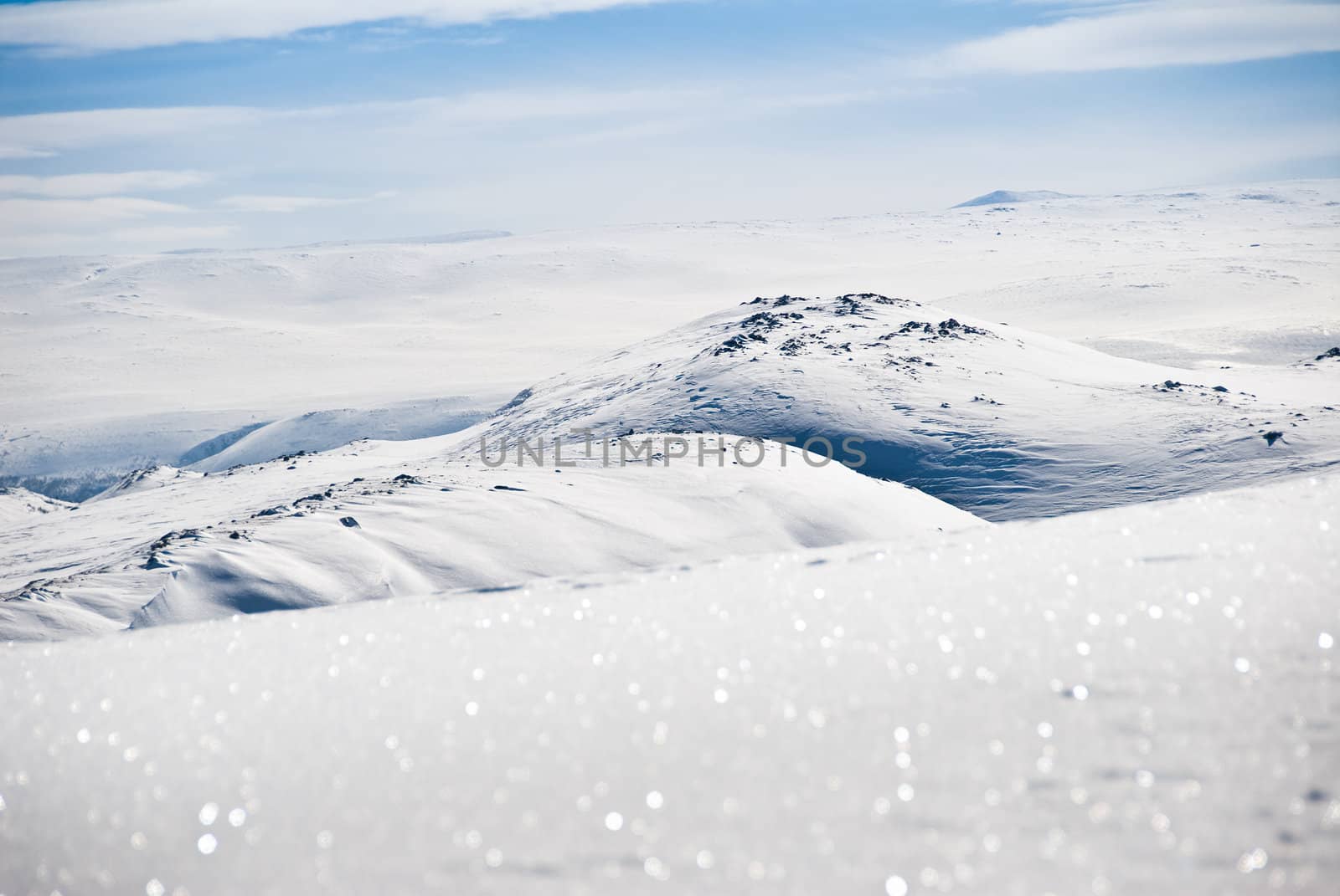 The top of a snowy mountain.