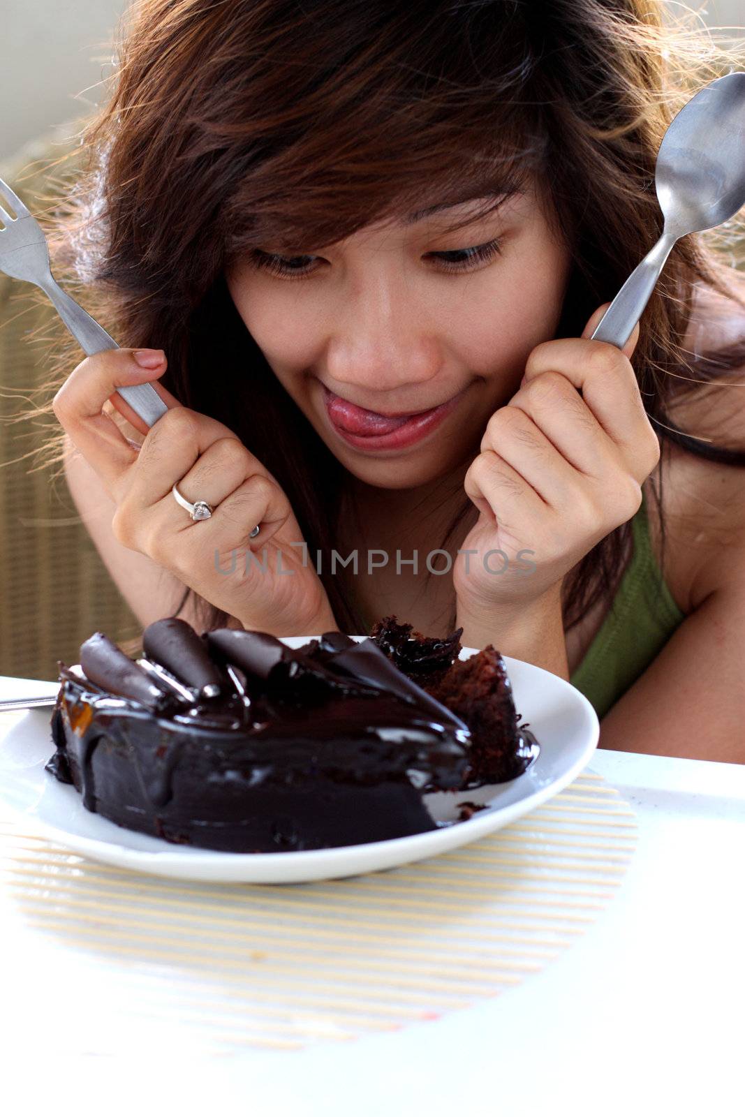 excited young lady with delicious cake