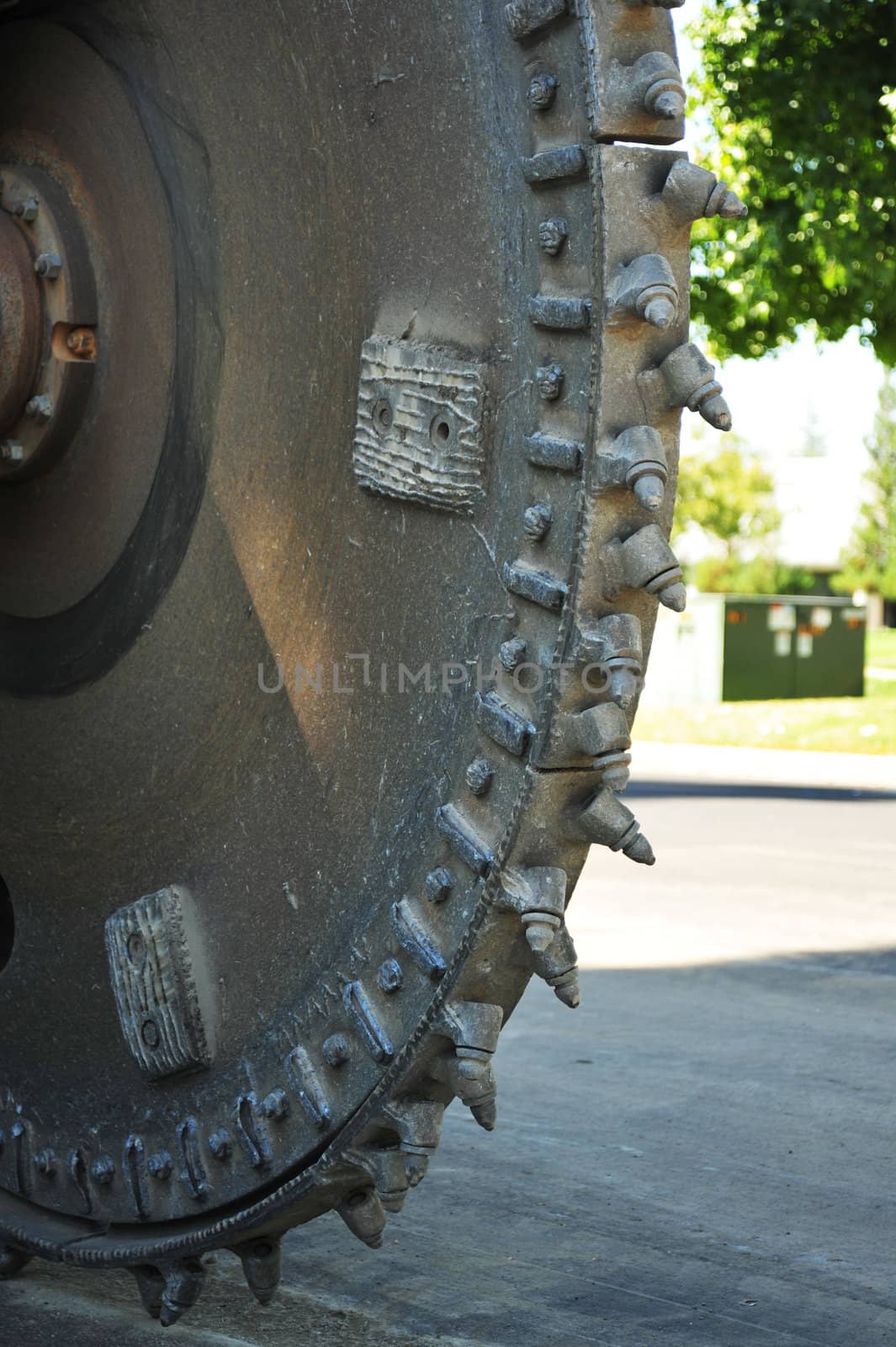 Steel Asphalt cutter head used cut the roadway to install fiber optic lines.