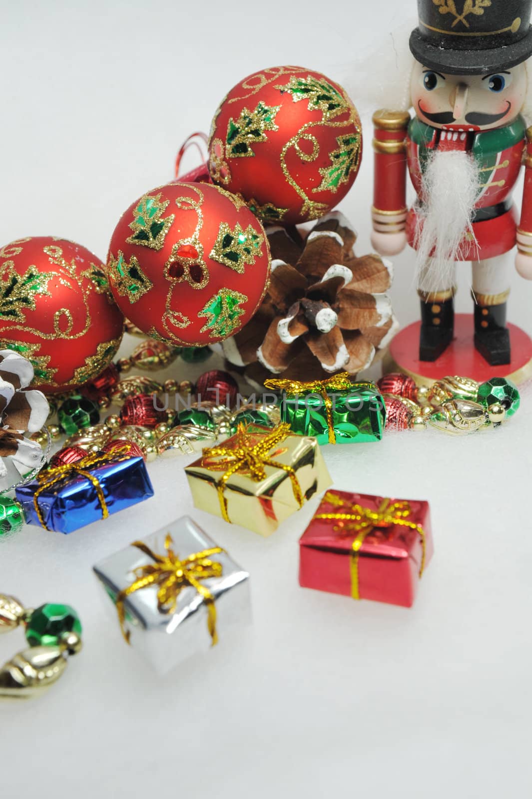 Assorted Christmas ornaments on a light background.
