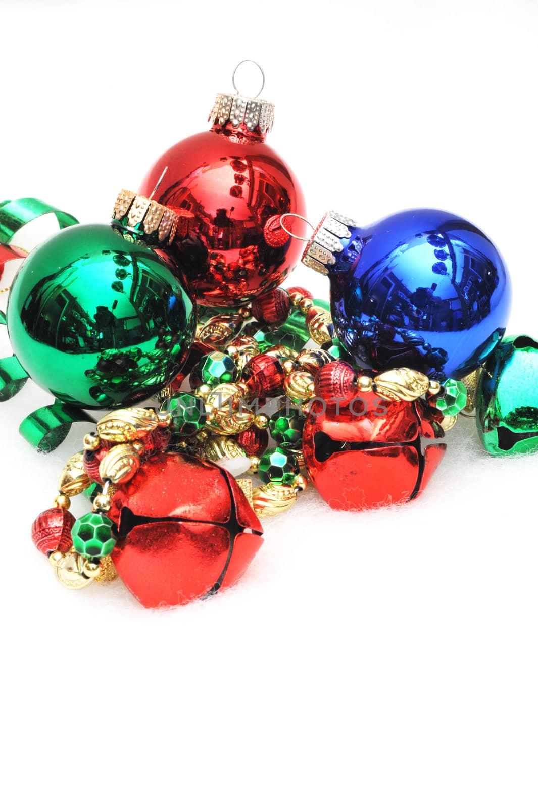 Red, green and blue ornaments and jingle bells