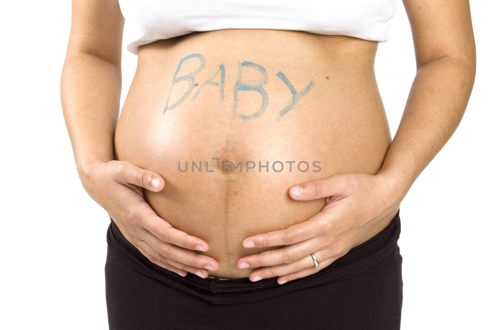 30 weeks pregnant teenager holding her belly with the word baby