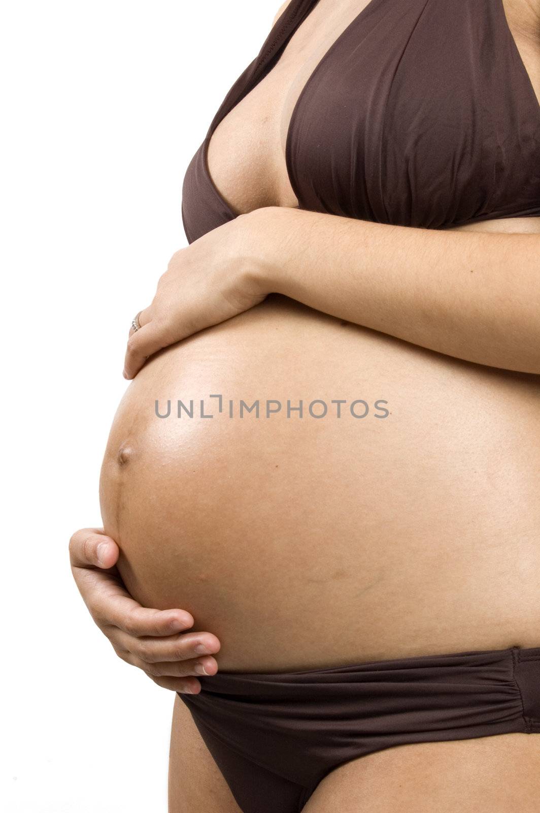 30 weeks pregnant teenager holding her belly by ladyminnie