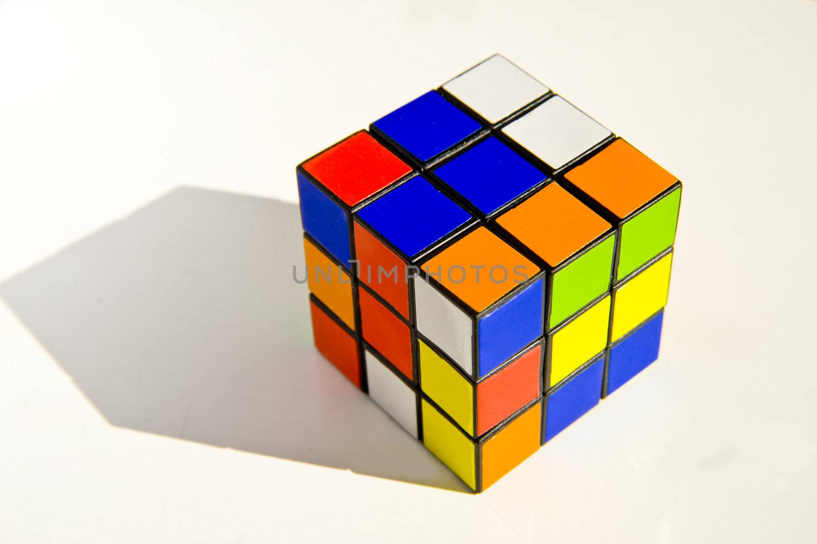 Rubik's cube over white background with gray shade