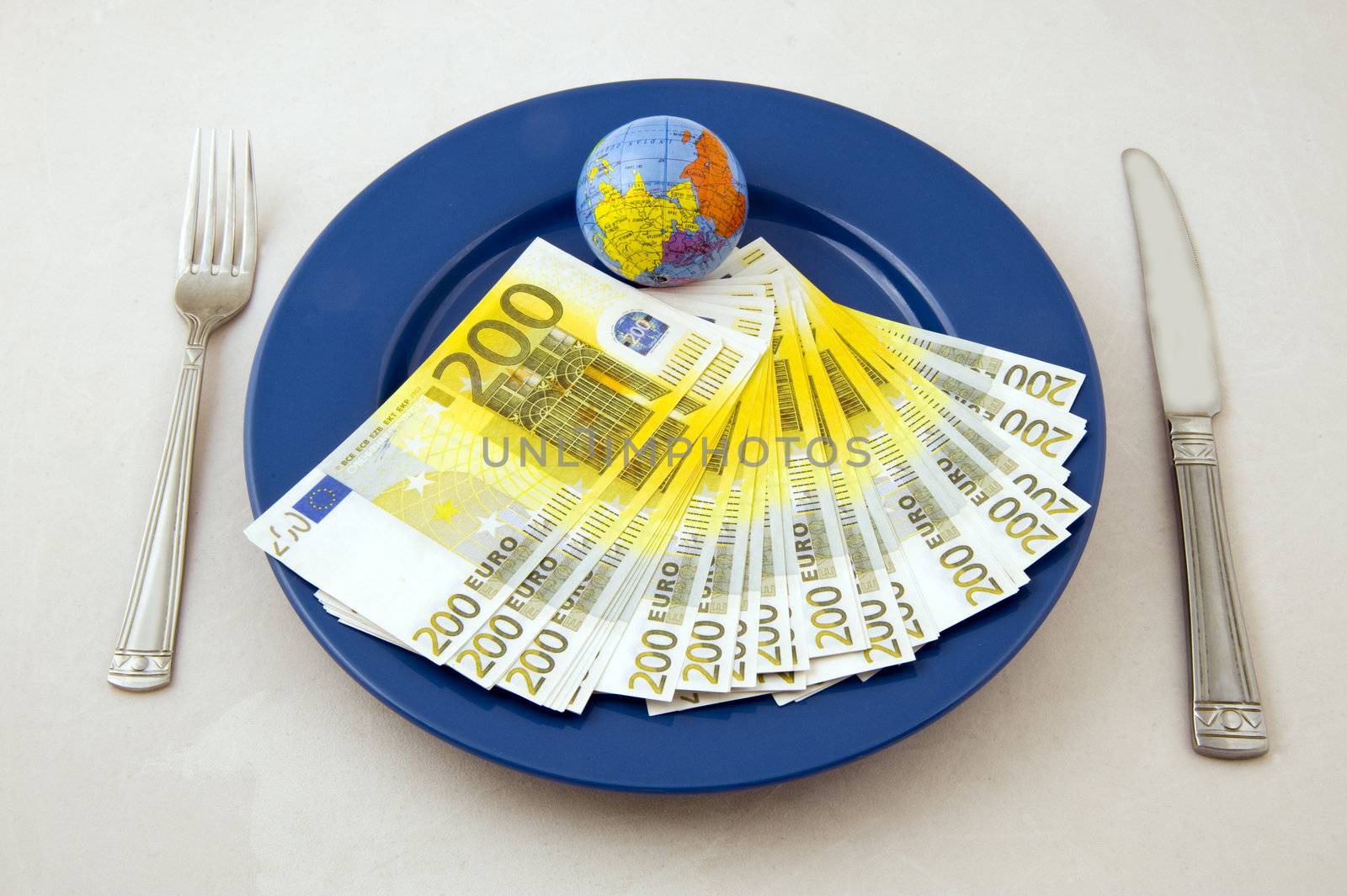 Euro money an small globe on the plate