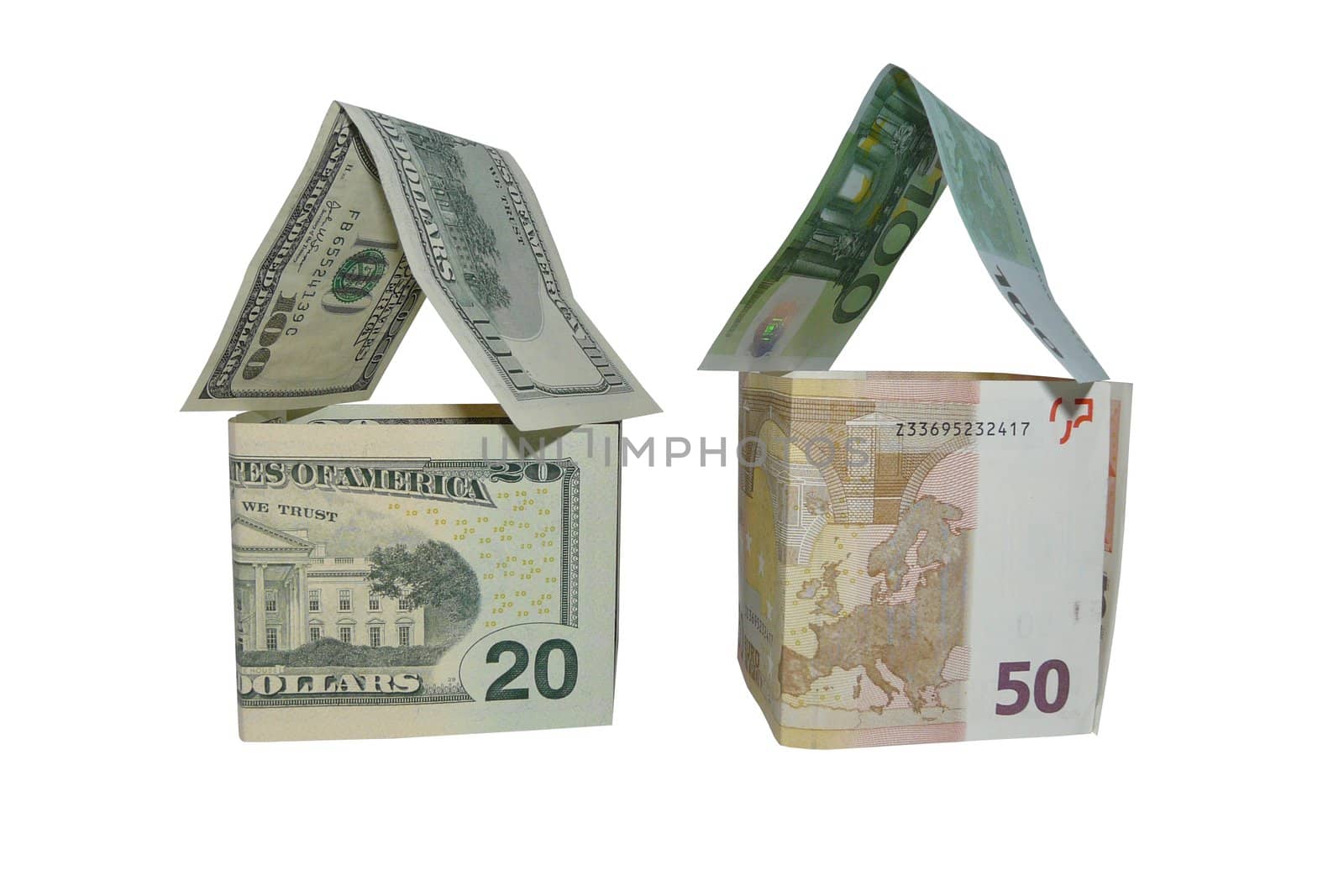 Two houses made of euro and dollar notes