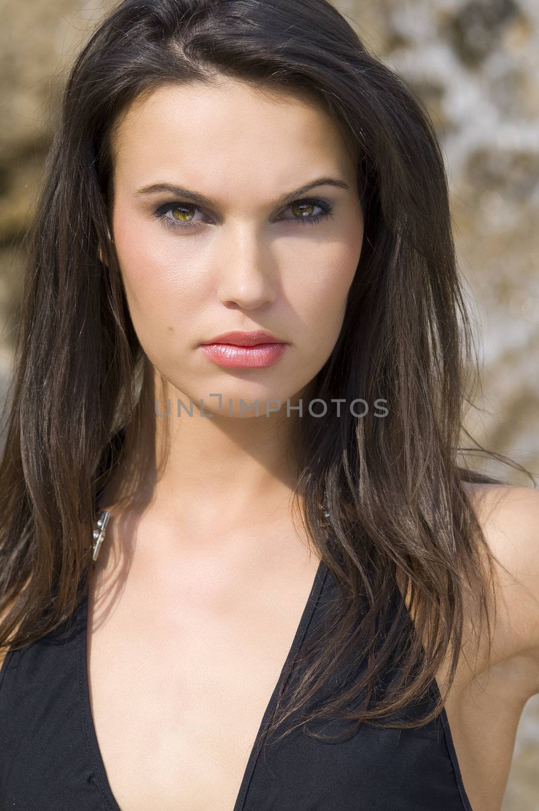nice fashion portrait of a young and beautiful girl with black hair