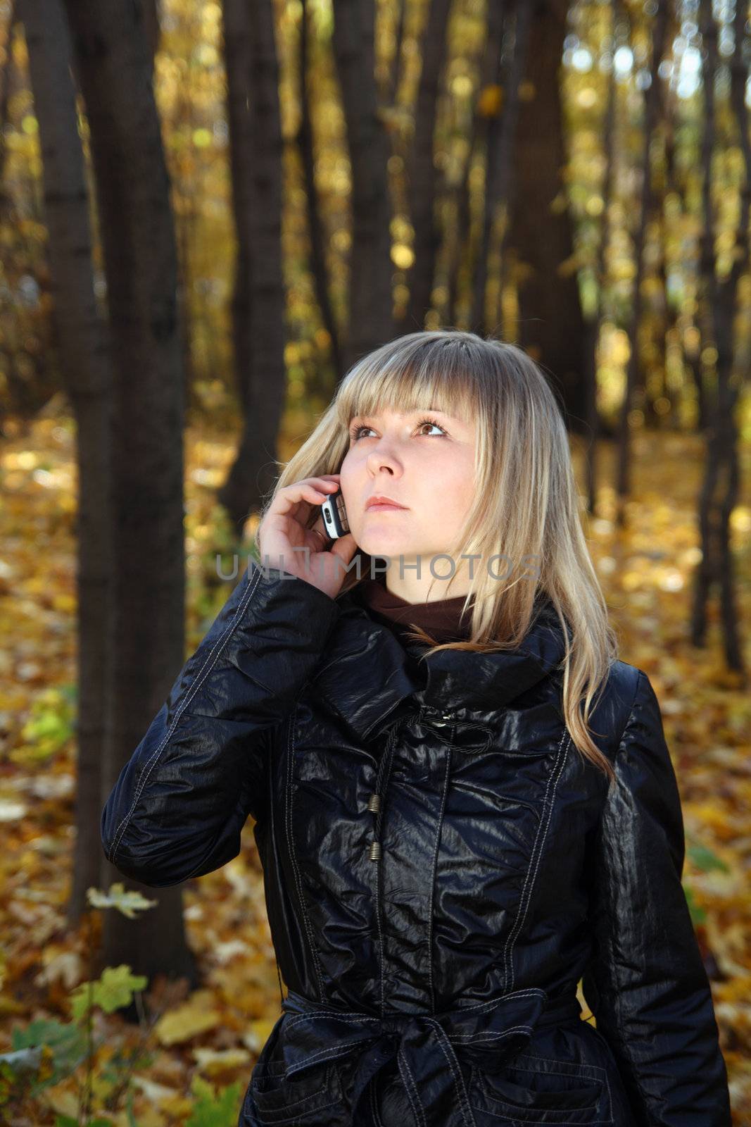 young woman talking by phone by Mikko