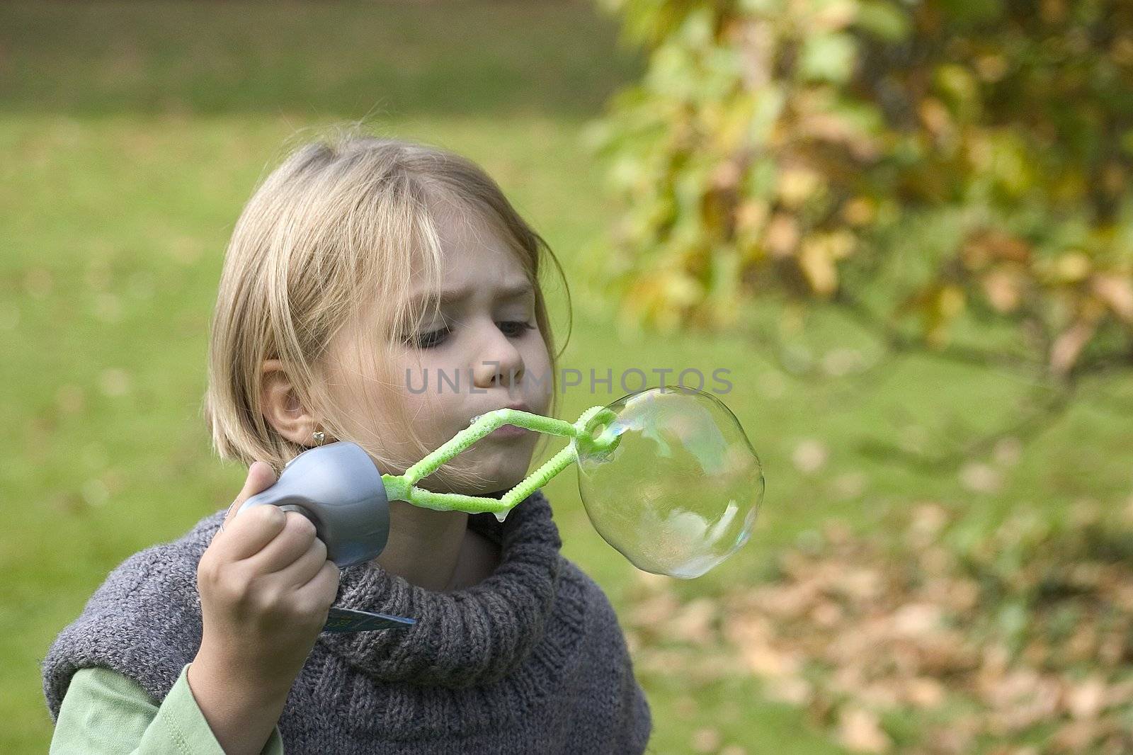 a little girl playing in the open air