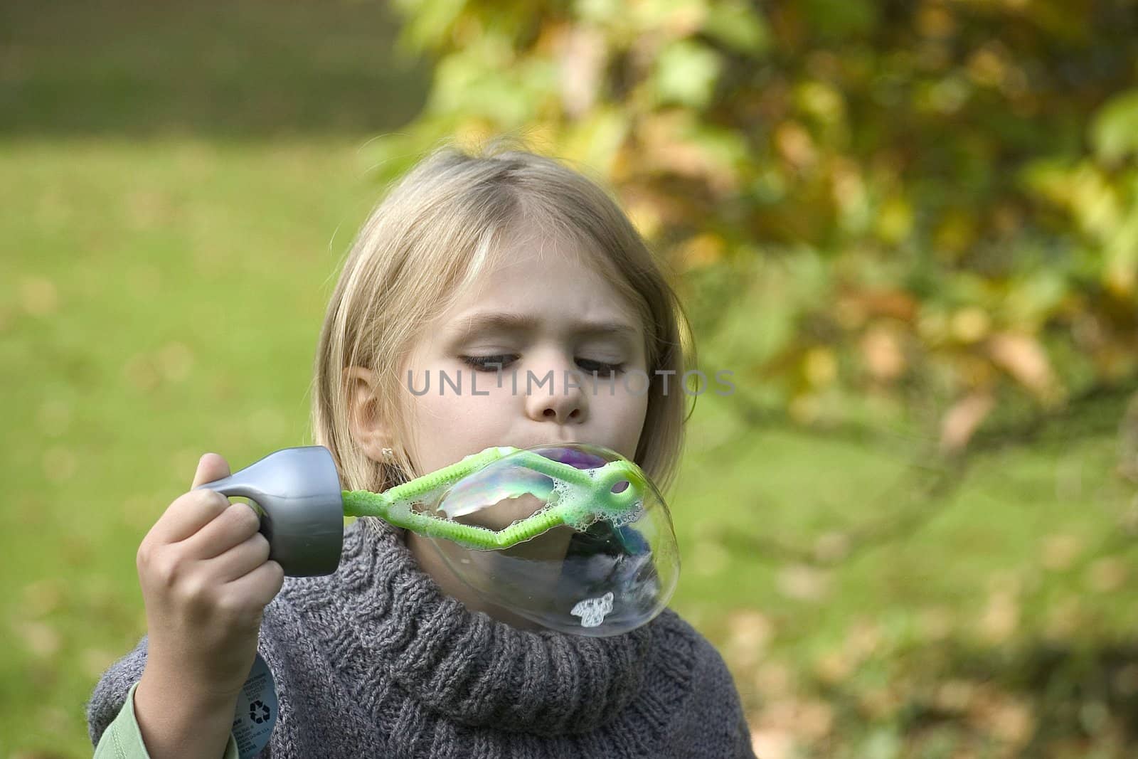 a little girl playing in the open air