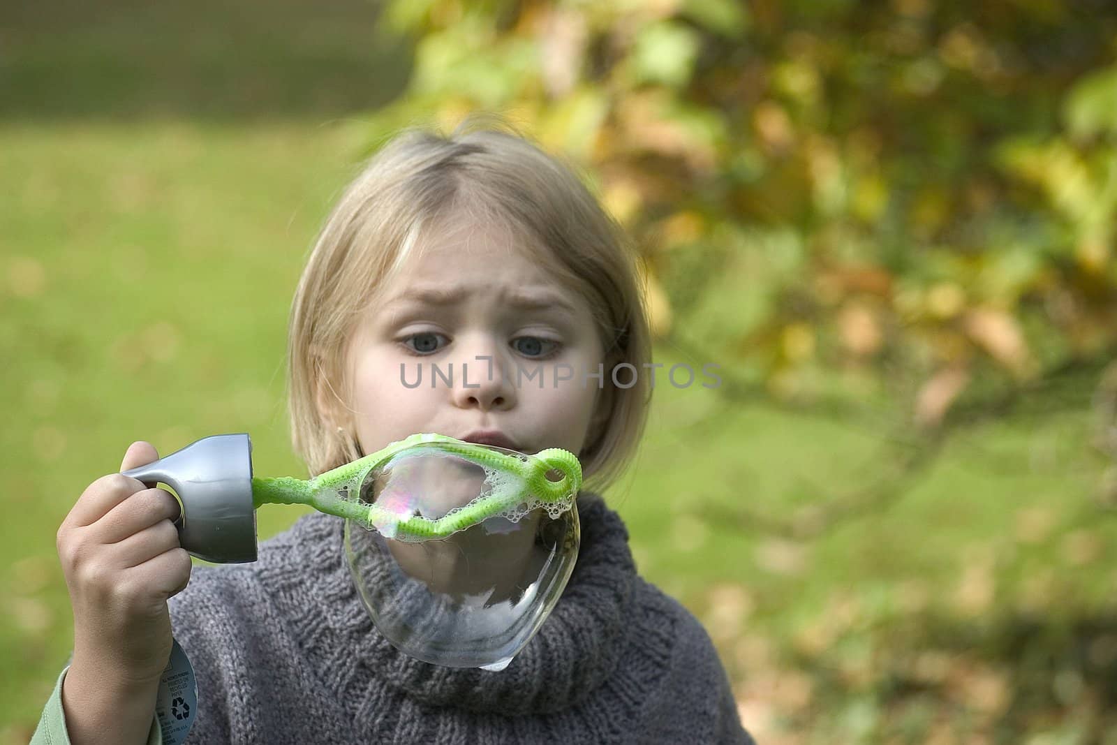 a little girl playing in the open air