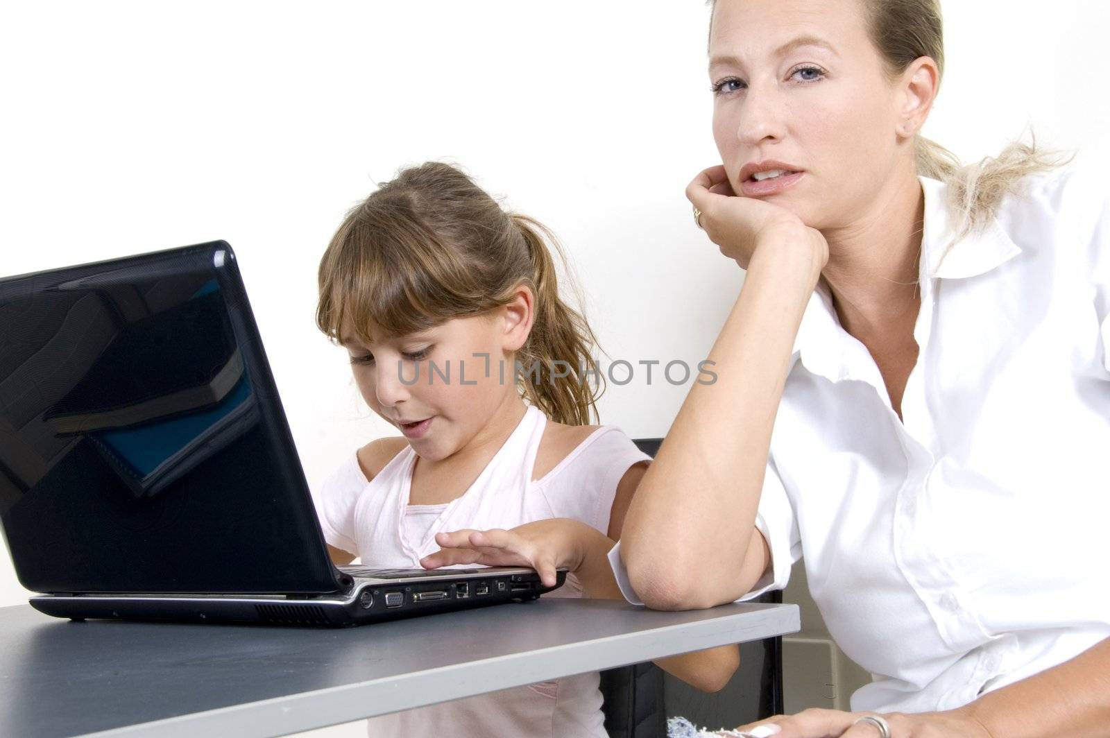portrait of mother and daughter working on laptop