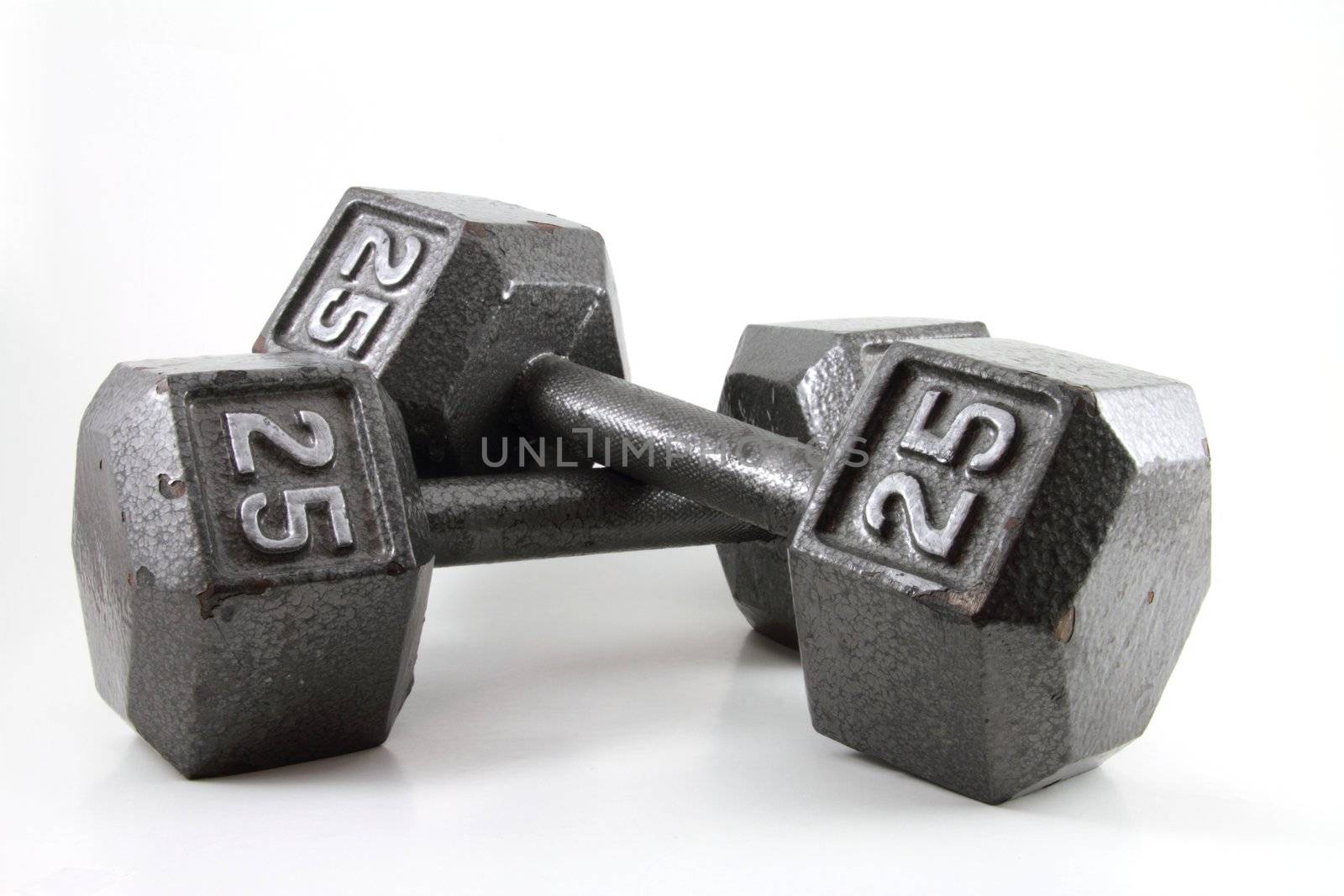 A pair of 25 pound dumbbells on a white backgroud.