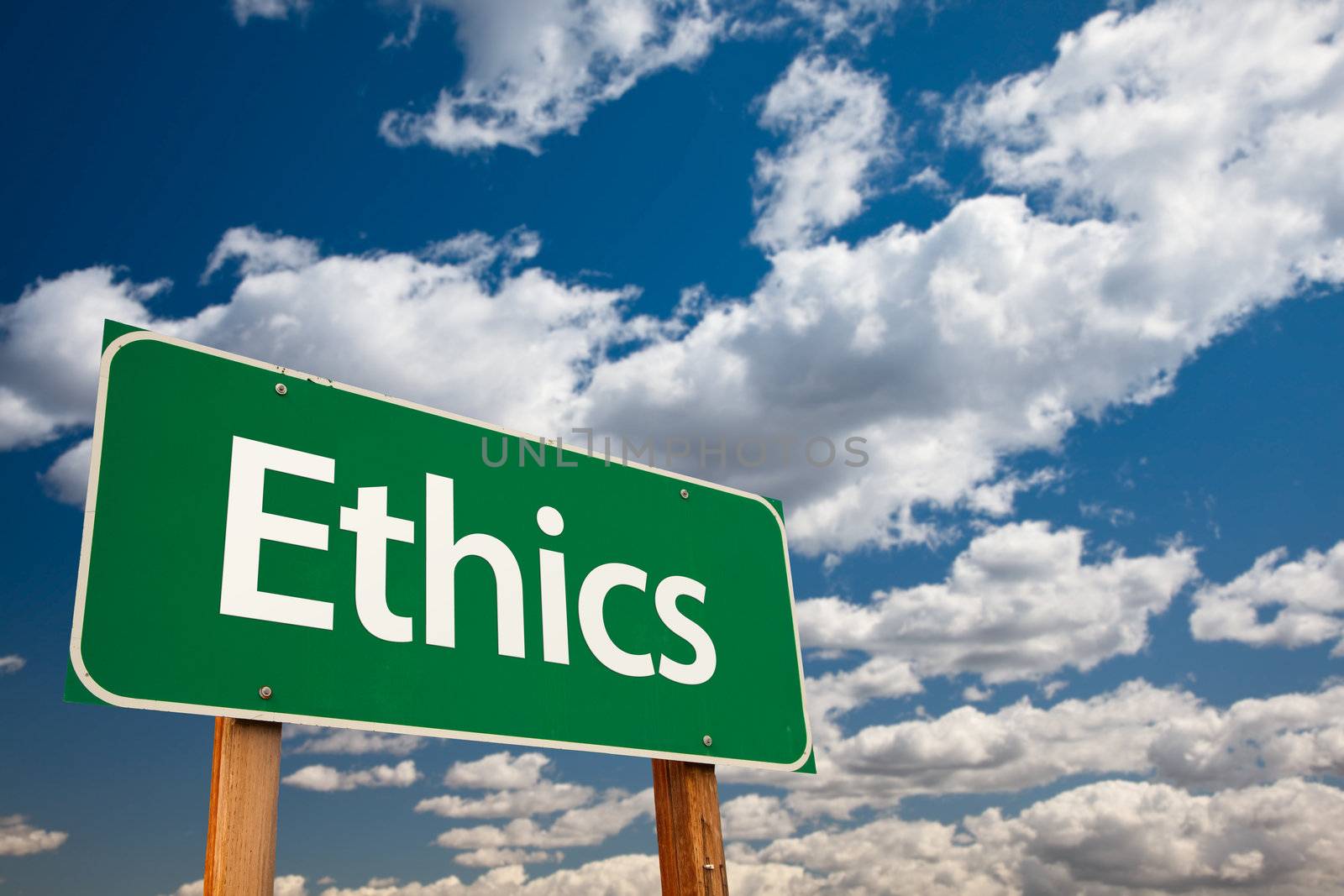 Ethics Green Road Sign with Copy Room Over The Dramatic Clouds and Sky.