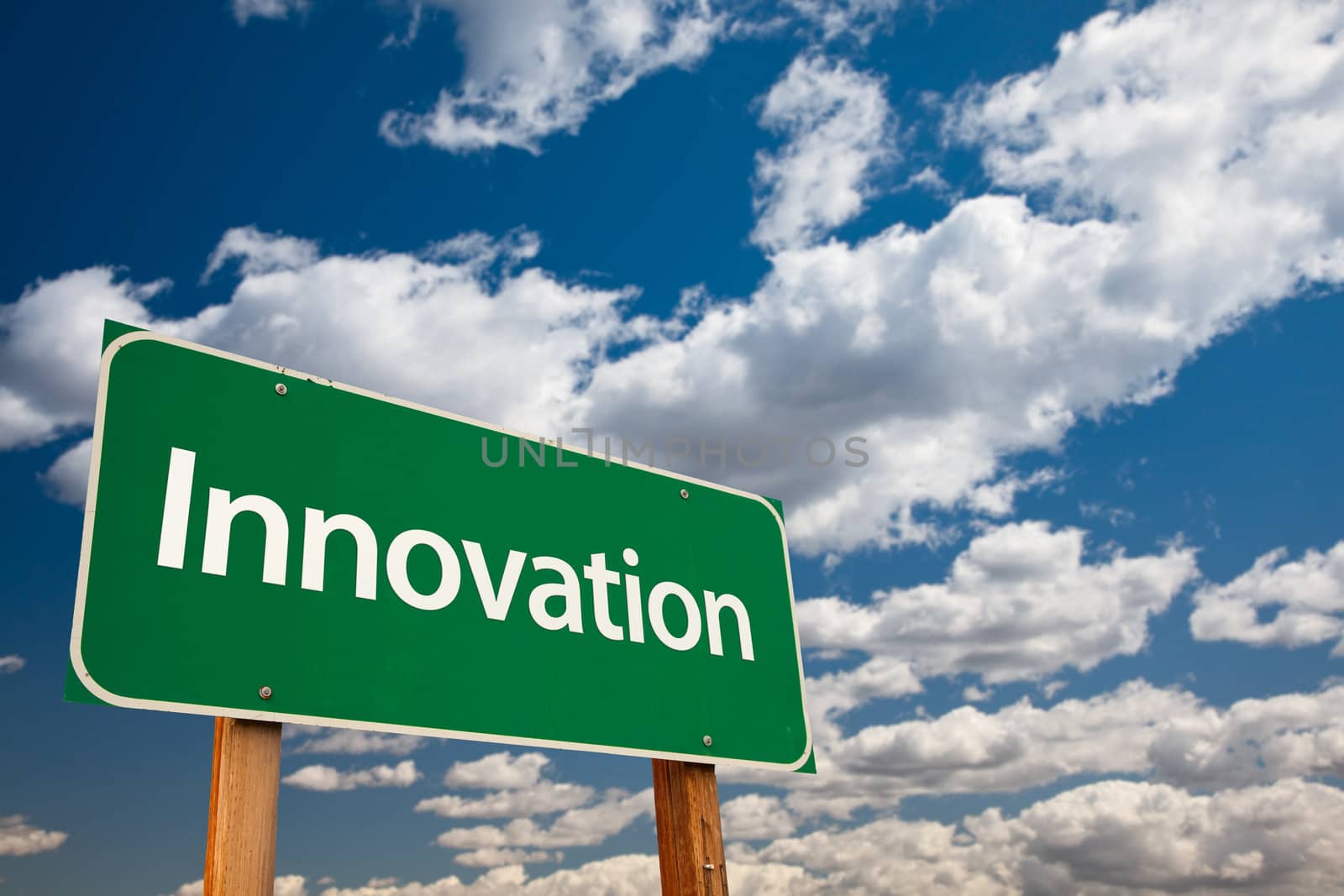 Innovation Green Road Sign with Copy Room Over The Dramatic Clouds and Sky.
