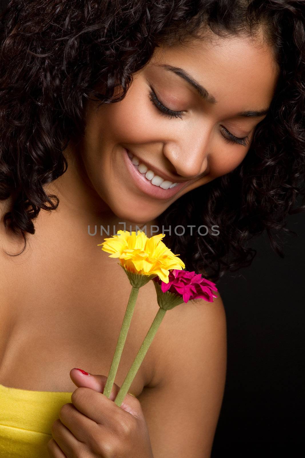Beautiful smiling woman holding flowers