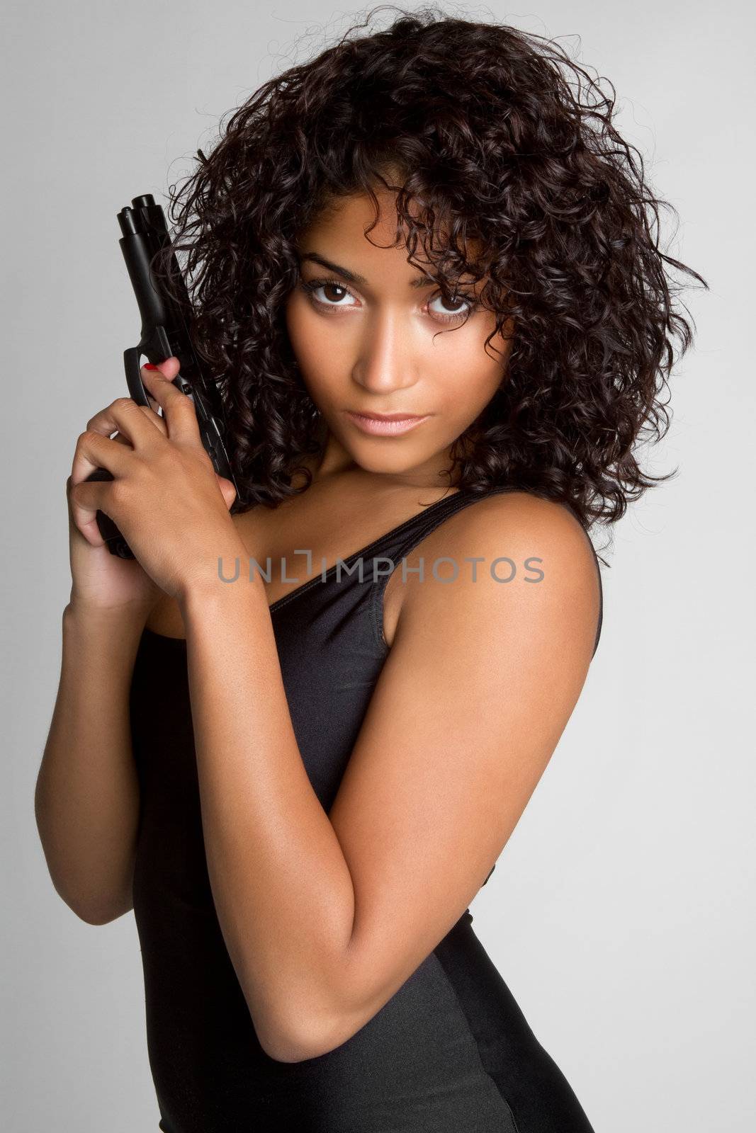 Sexy black woman holding gun