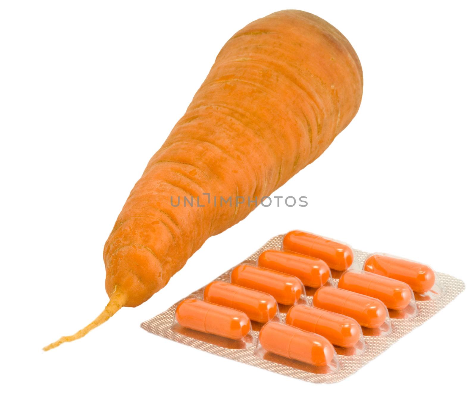 Vitamin pills with carrot on isolated white. Make your choice