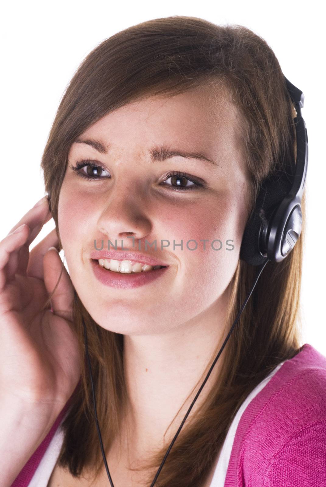 Teenage girl with headphone; isolated on a white background.
