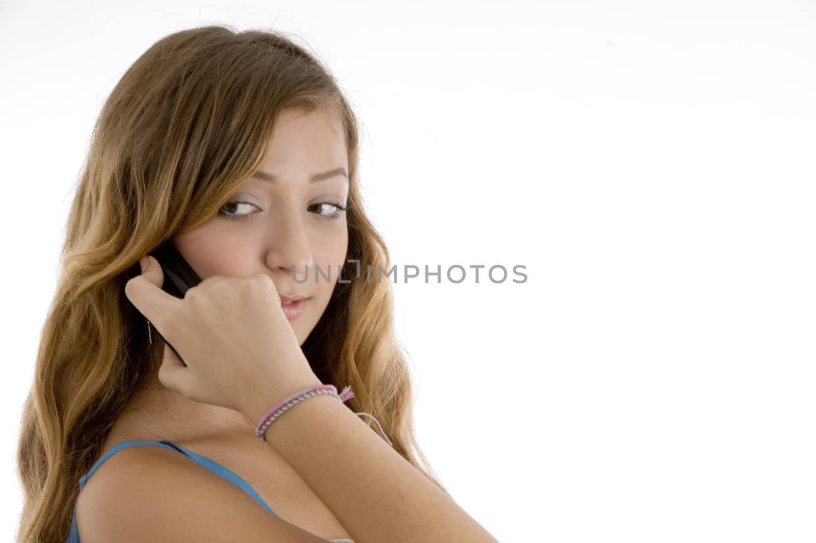 school girl talking on mobile phone on  an isolated white background 