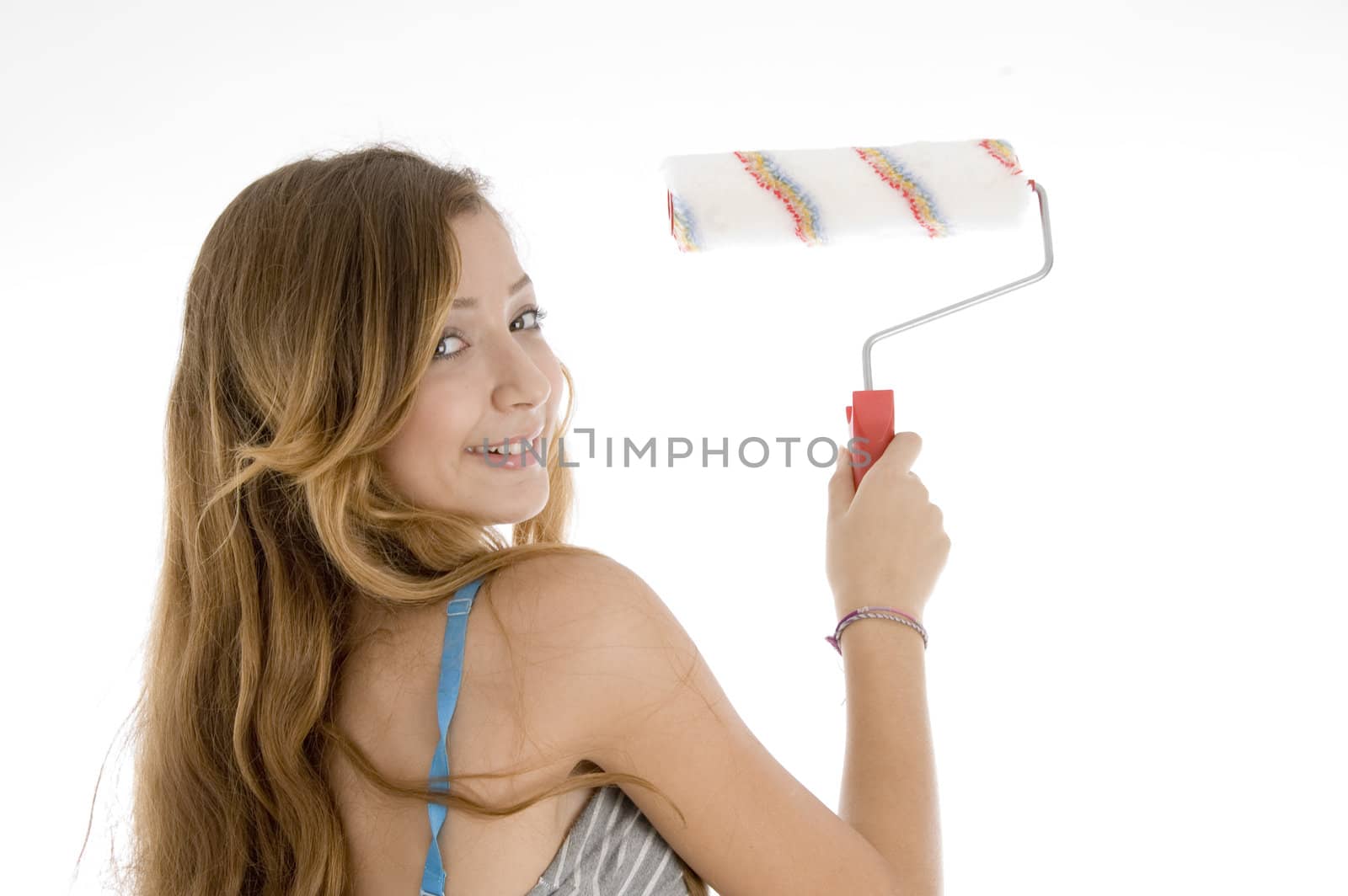  teenager painting with roller brush on  an isolated white background 