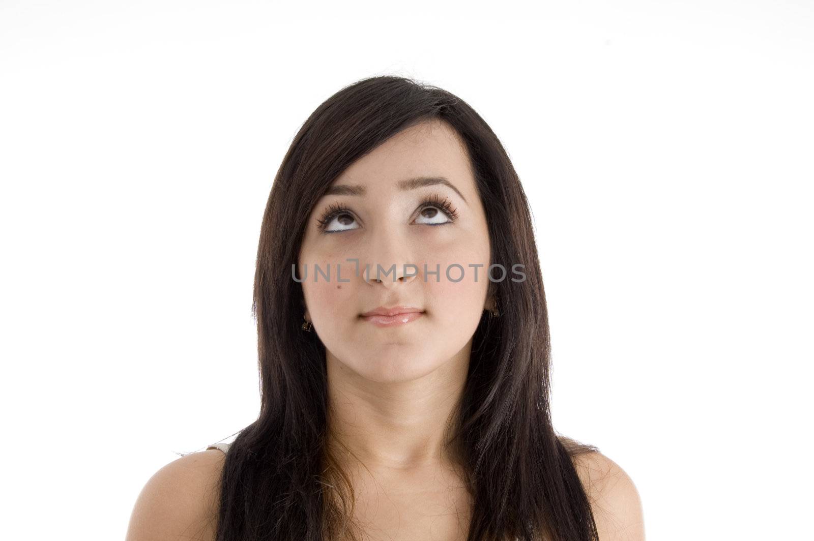 portrait of pretty brunette female looking upward on  an isolated white background 