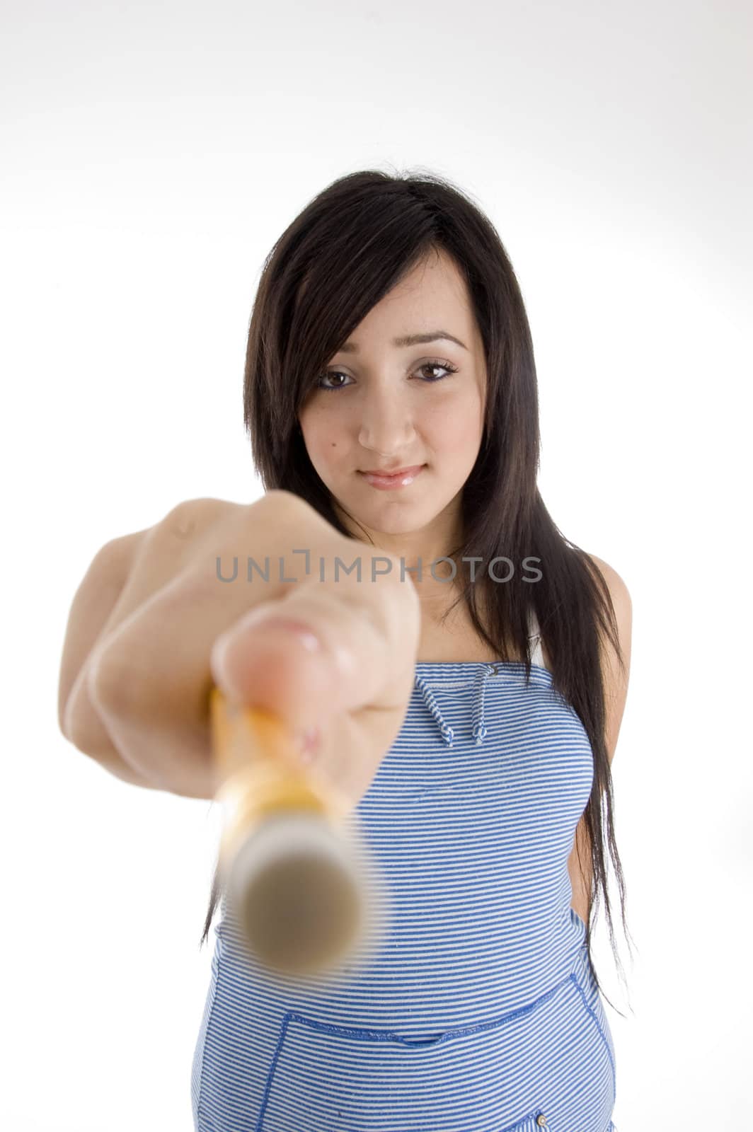 attractive teenager showing pencil to camera on  an isolated white background 