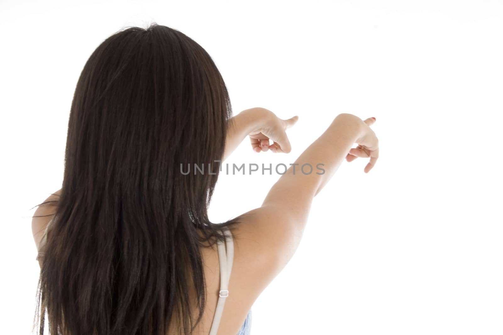 teenage girl pointing on  an isolated white background 