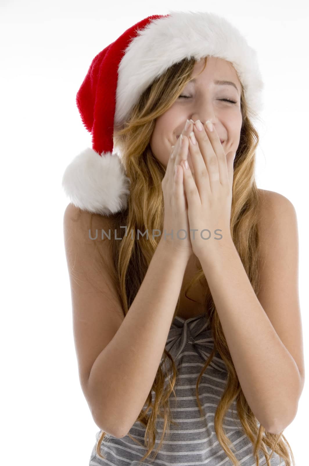 front view of laughing girl with christmas hat on  an isolated white background 