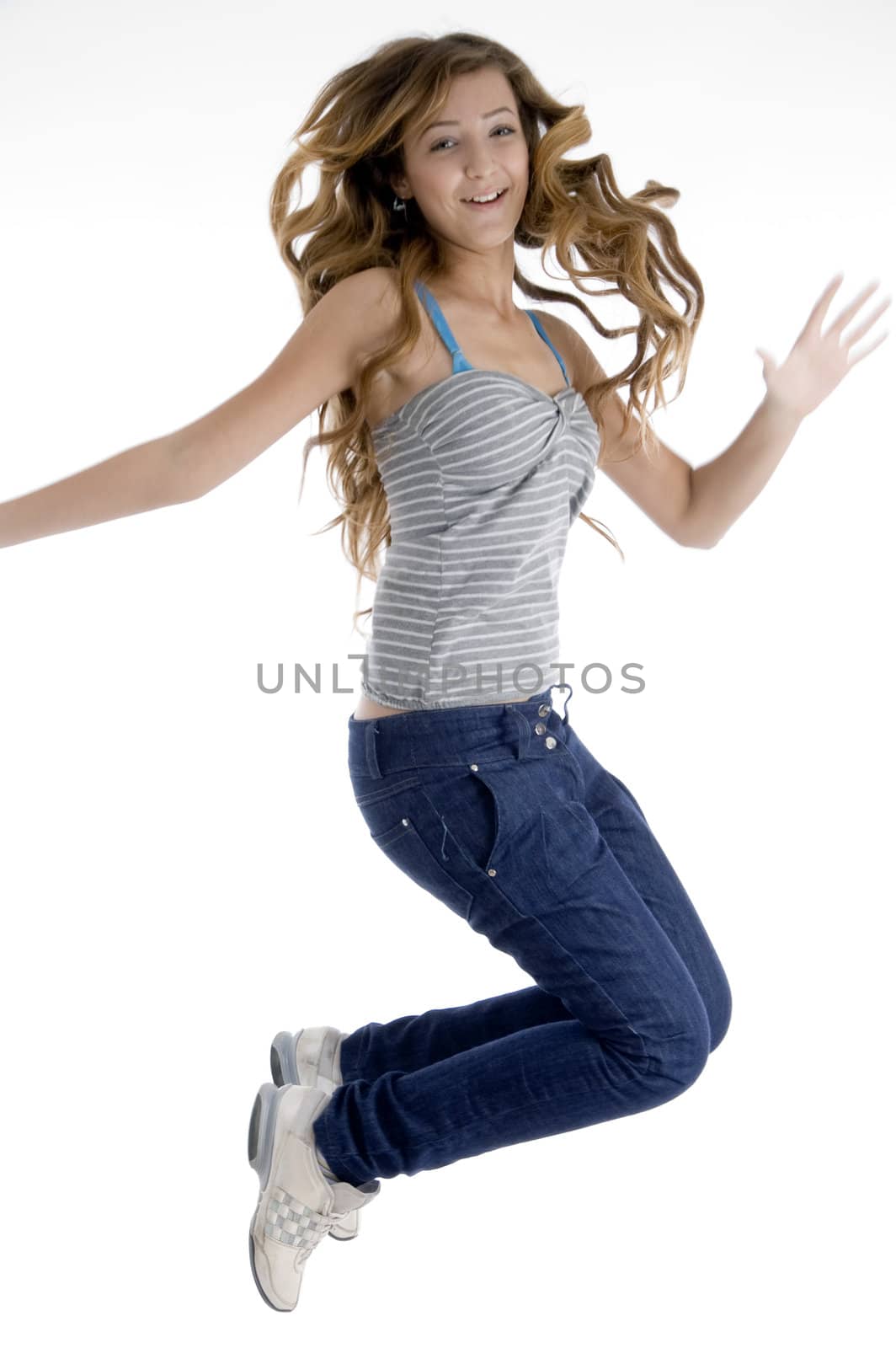 happy jumping young girl on  an isolated white background 