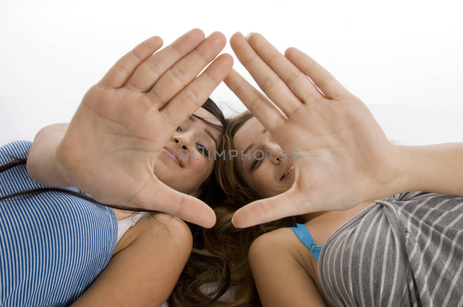 laying girls showing hand gesture on  an isolated white background 