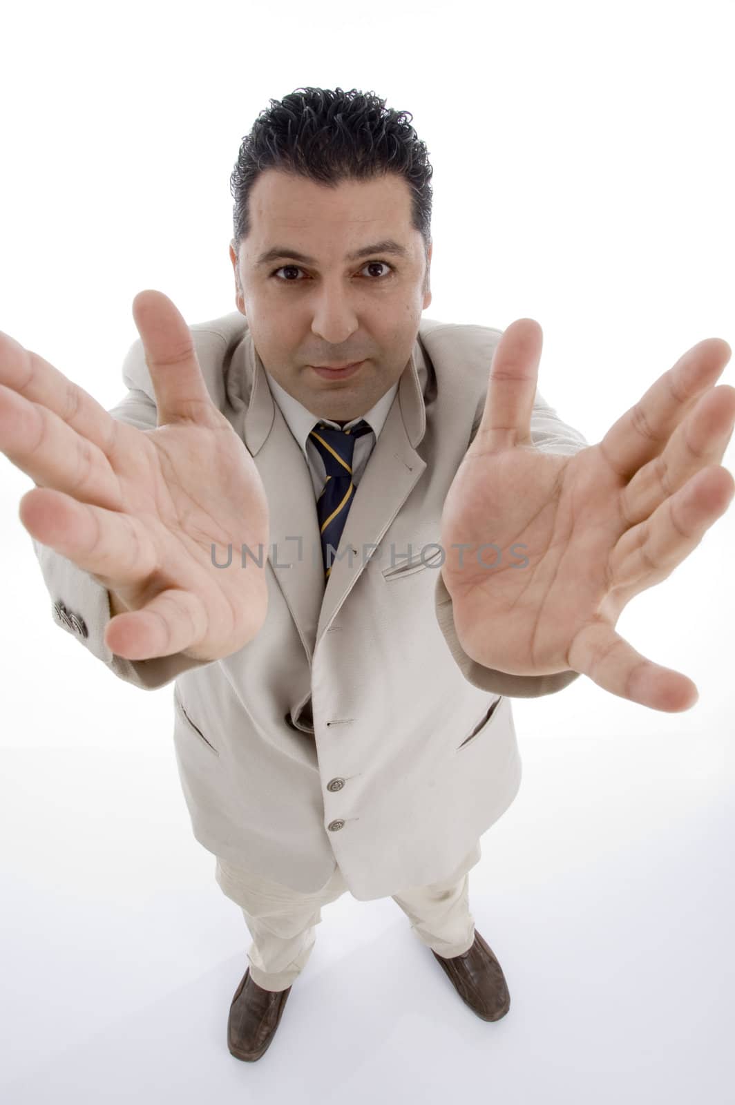 standing businessman showing his palms on  an isolated white background 