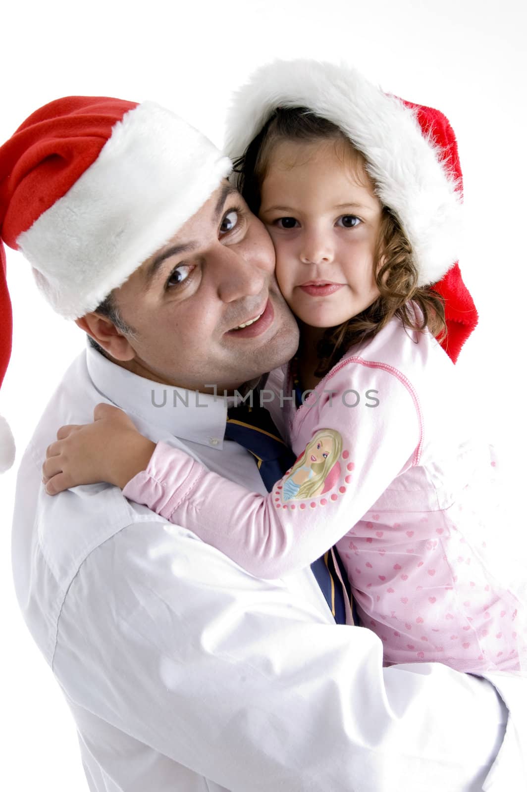 father and cute daughter with christmas hat holding each other