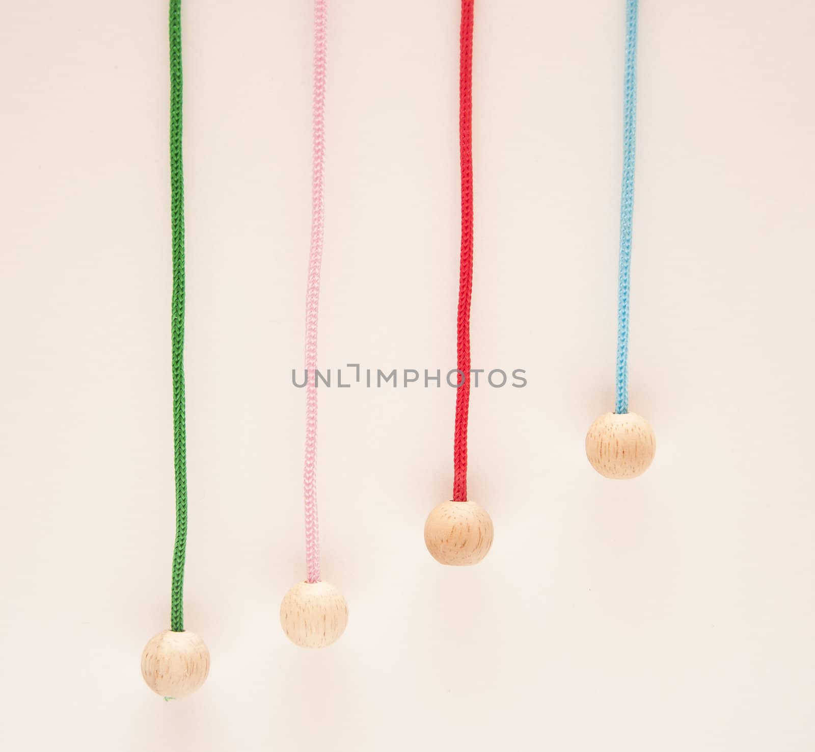Hanging colour laces with wooden round tips