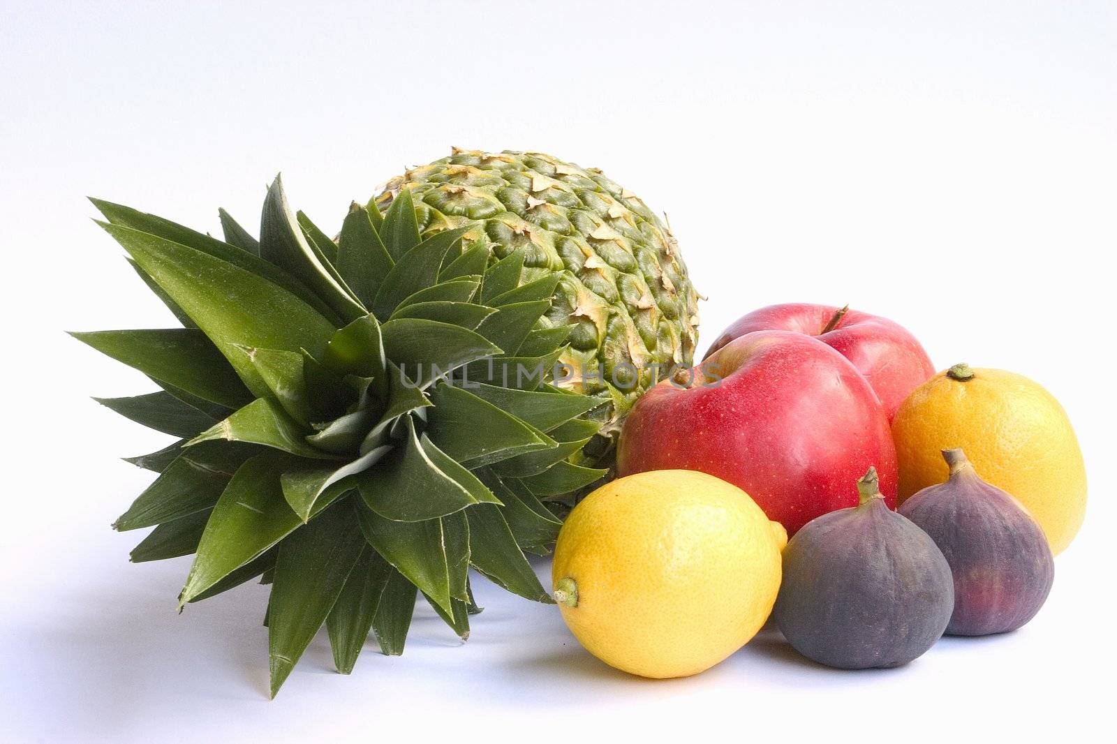 Ananas and other fruits isolated on white background.
