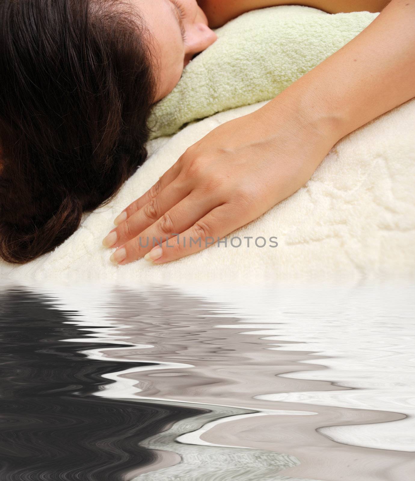 female laying over towels by mettus