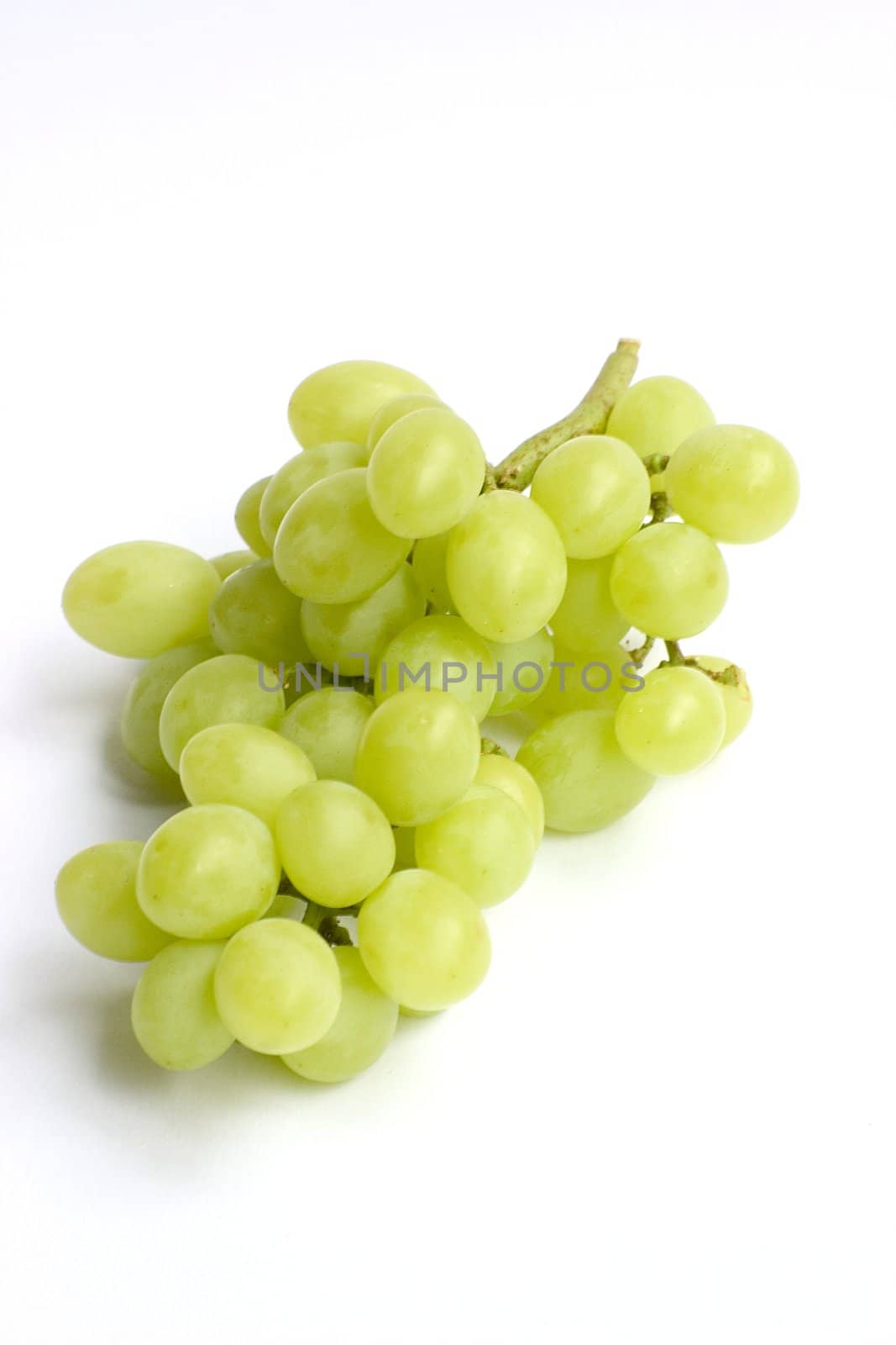 Bunch of green grapes over white background