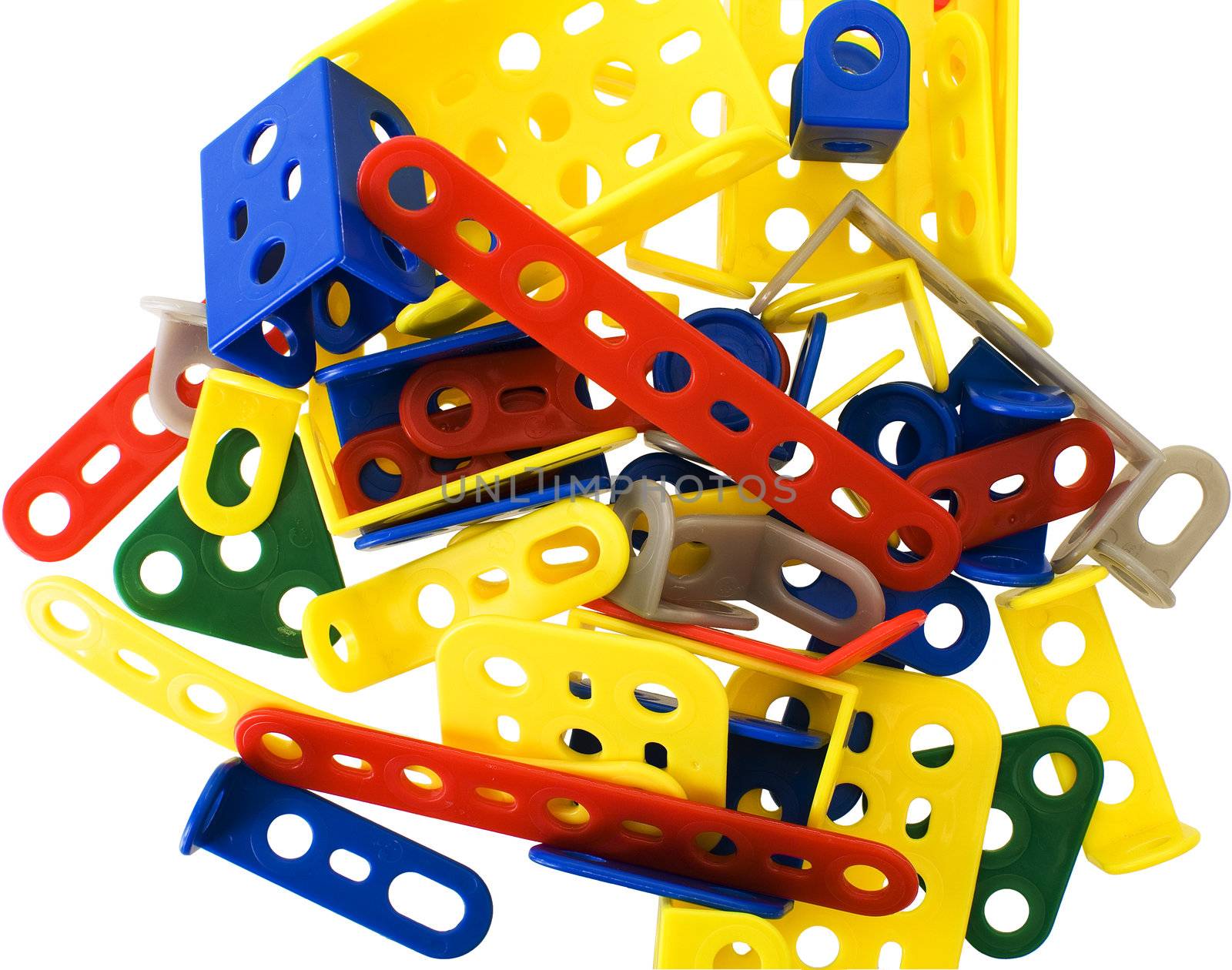 A bunch of colorful detail meccano on a white background