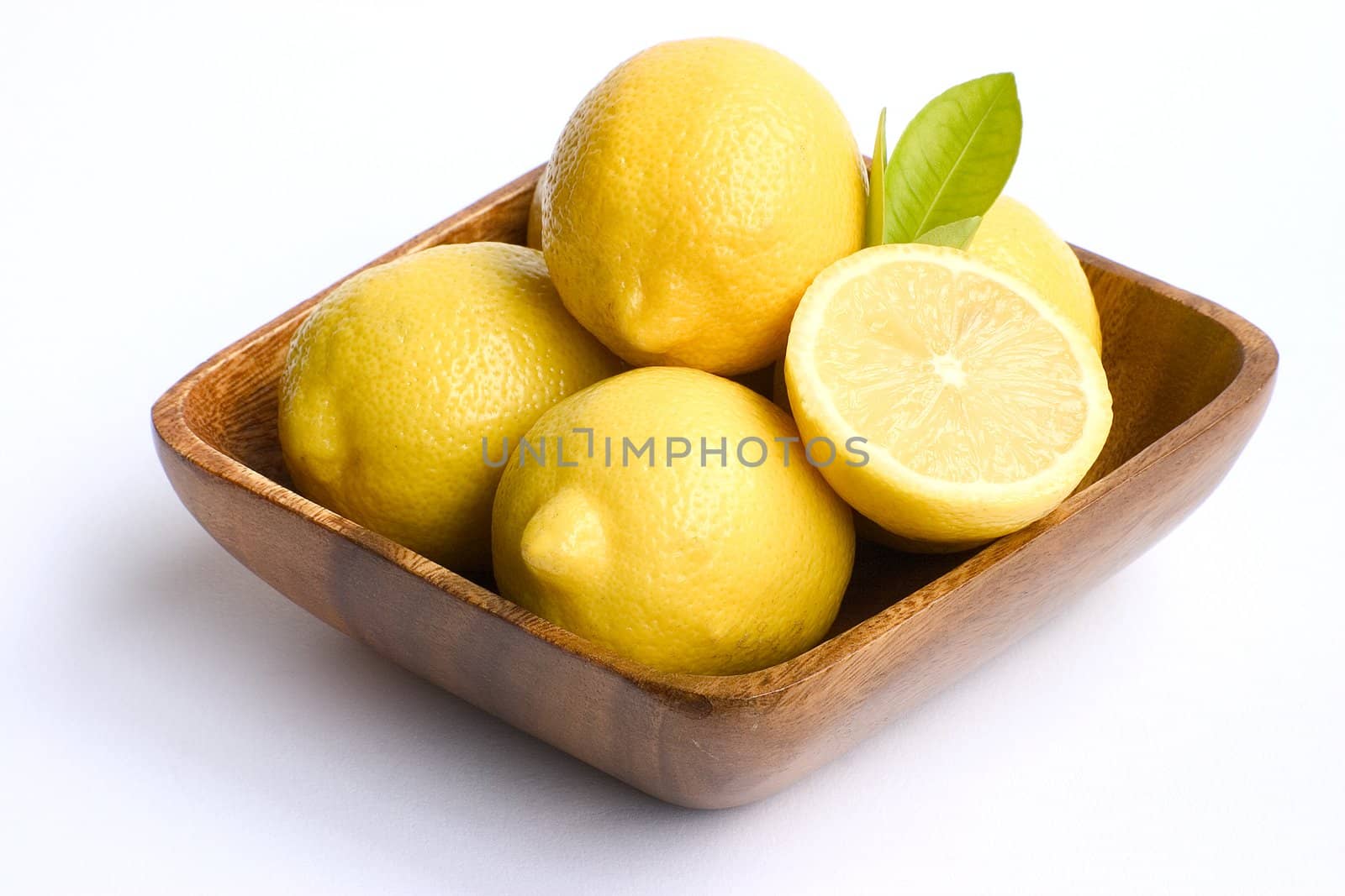 A bowl of bright yellow lemons.