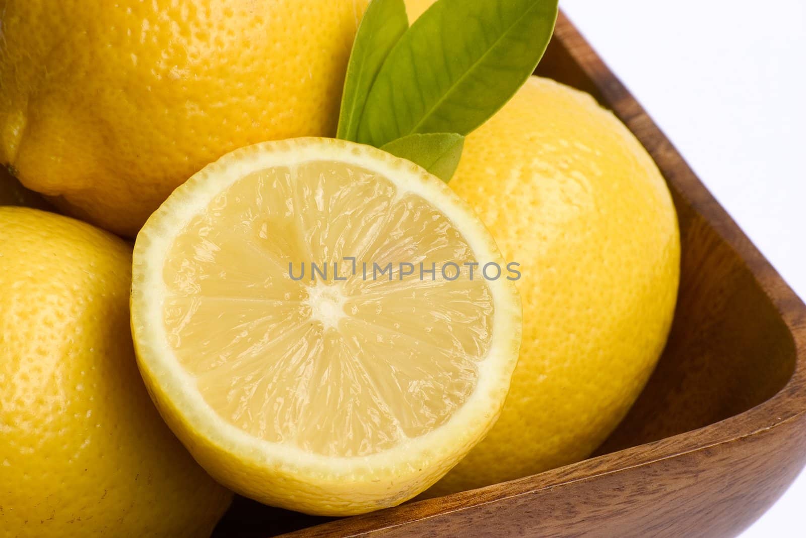 A bowl of bright yellow lemons.