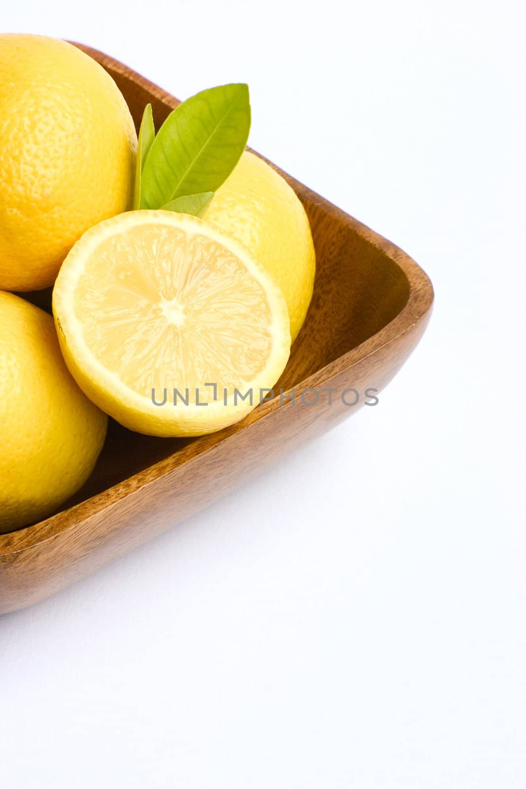 A bowl of bright yellow lemons.