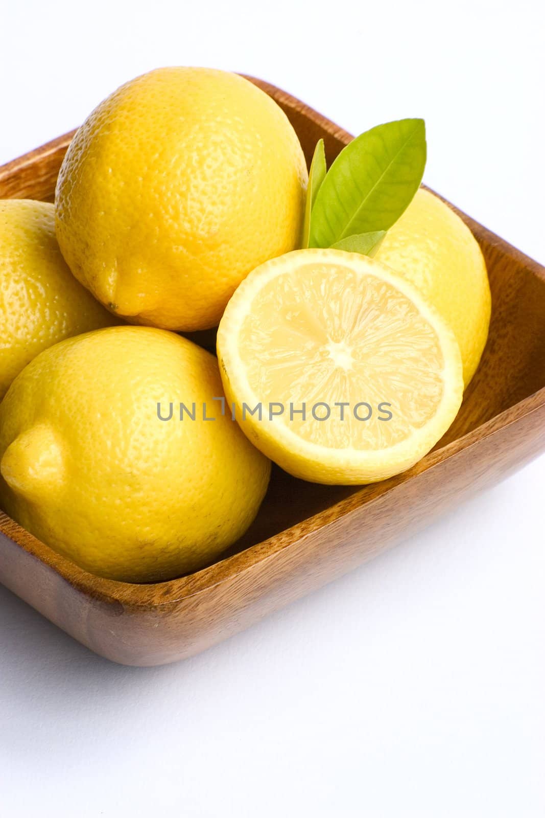 A bowl of bright yellow lemons.