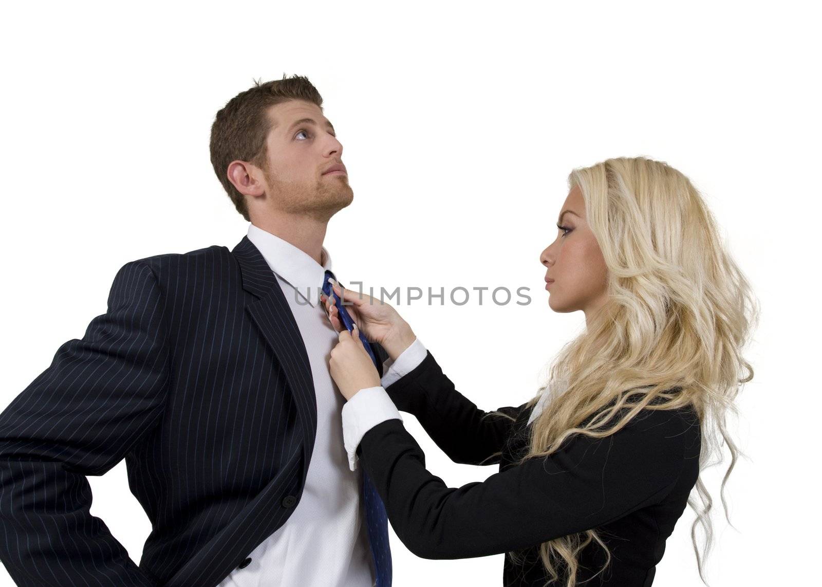 lady knotting tie of man by smagal
