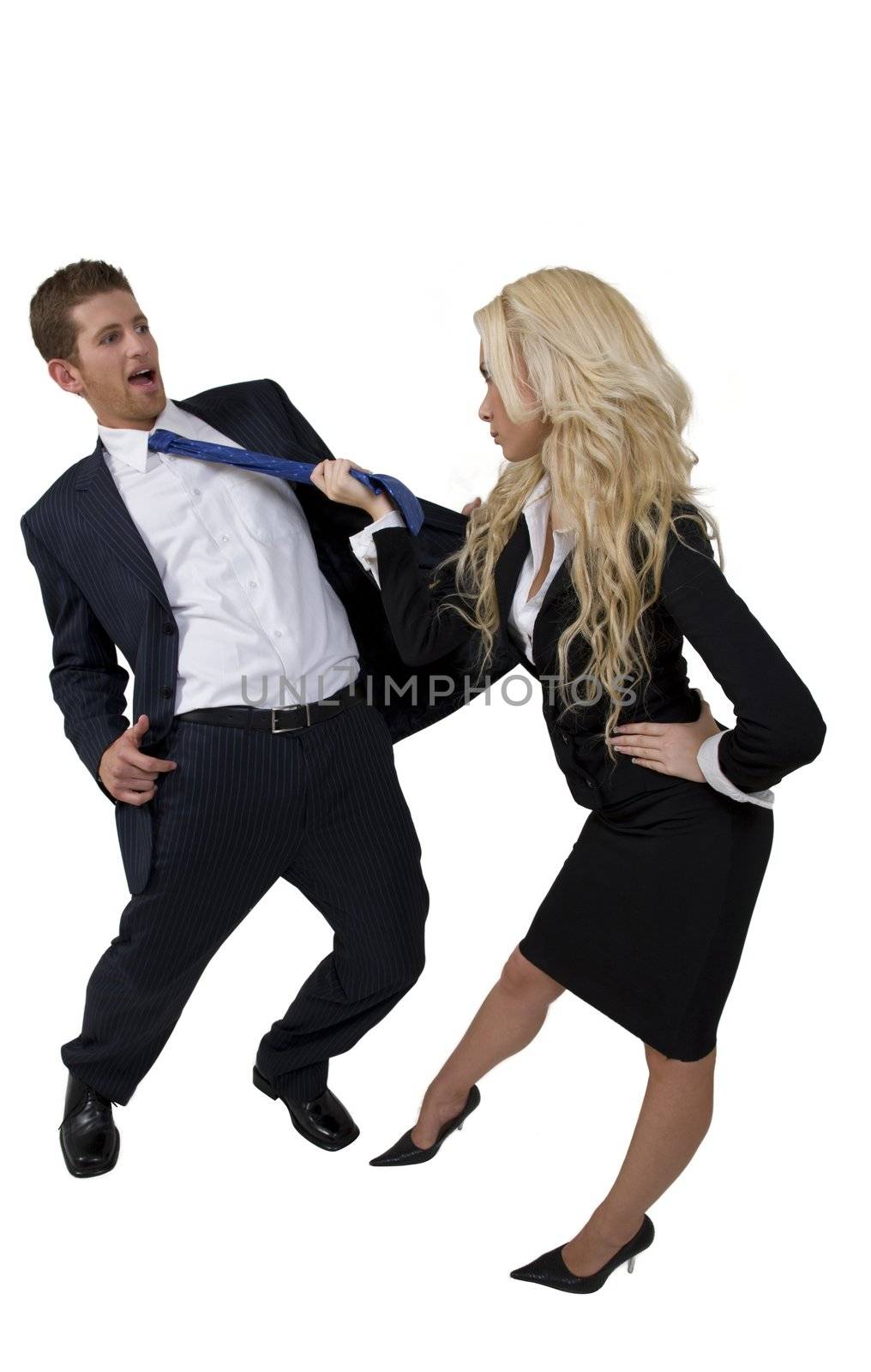 female pulling tie of man by smagal