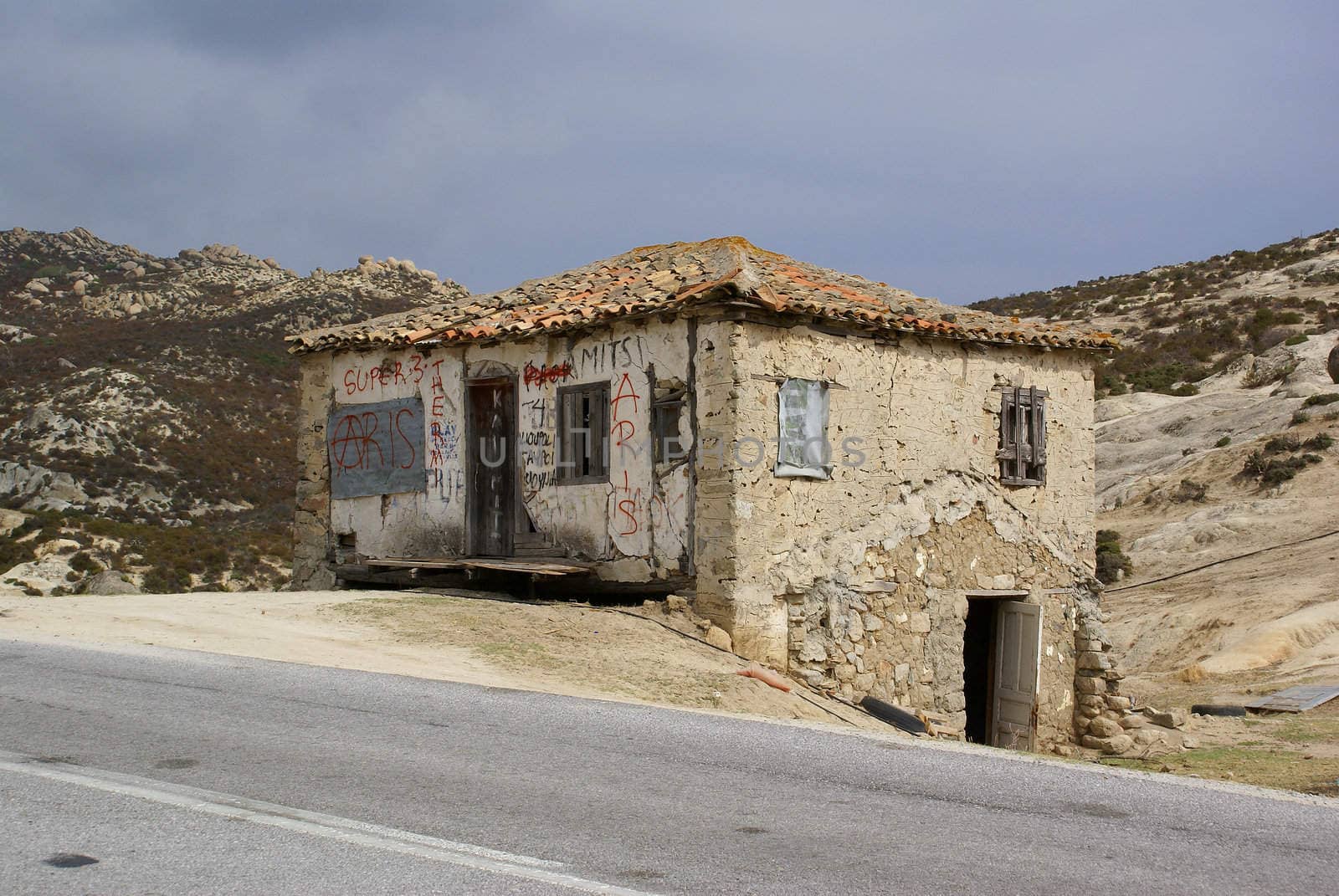 A small old house right next to the road in Sithonia (Chalkidiki).