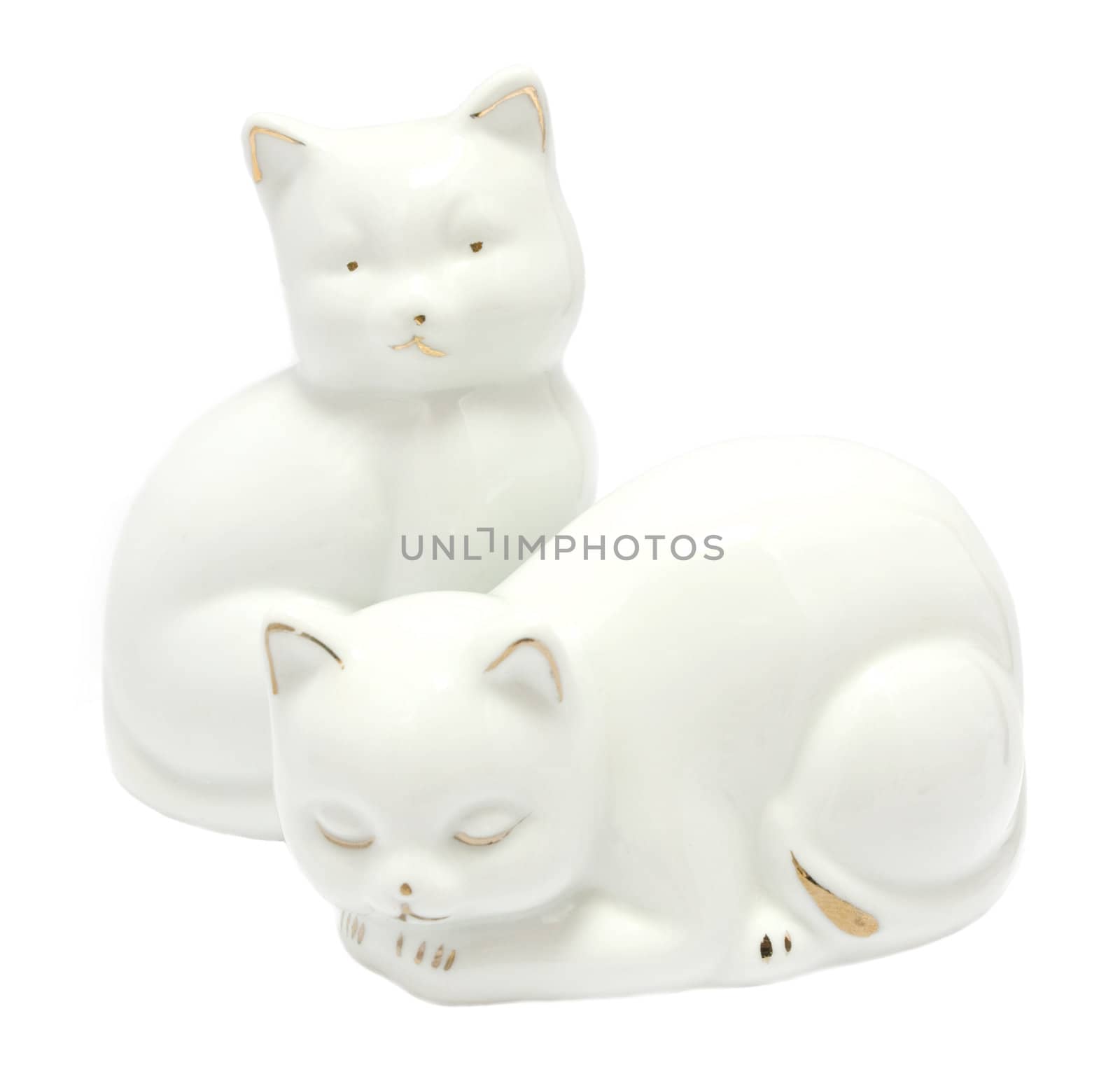 Kitsch white porcelain kitten figurines isolated on white background