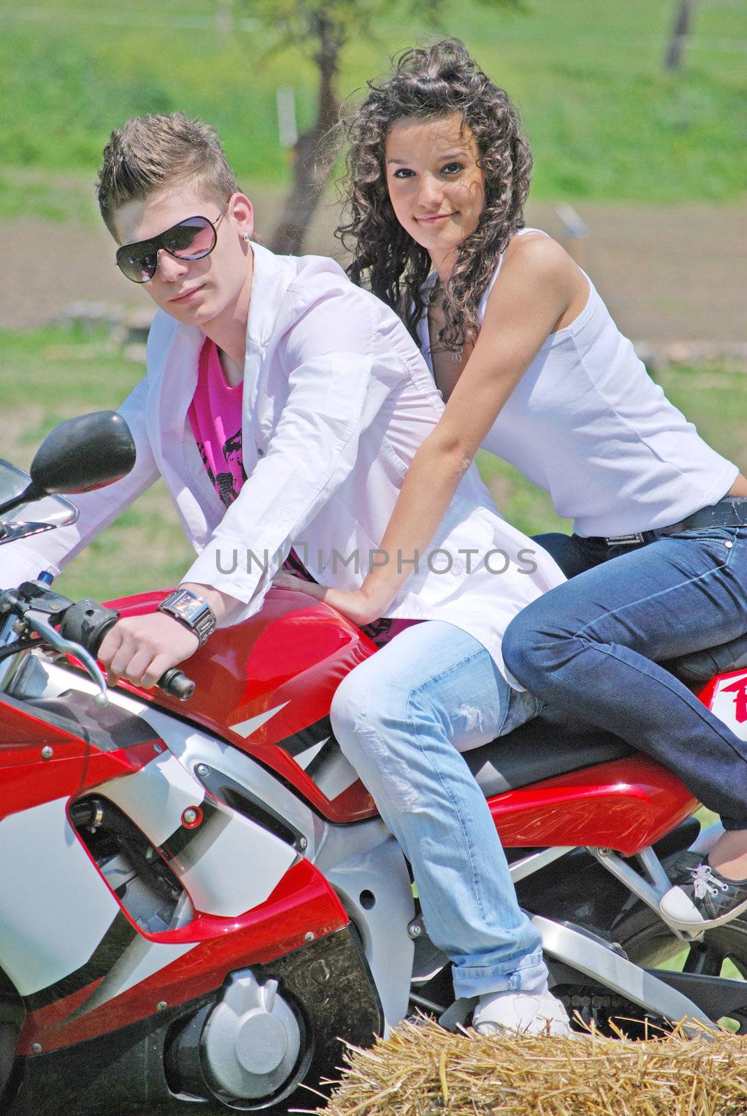 young couple in love riding a motorbike