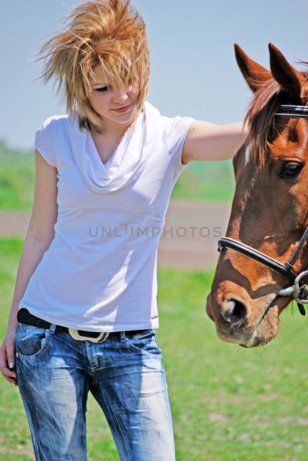 young and attractive woman riding brown horse